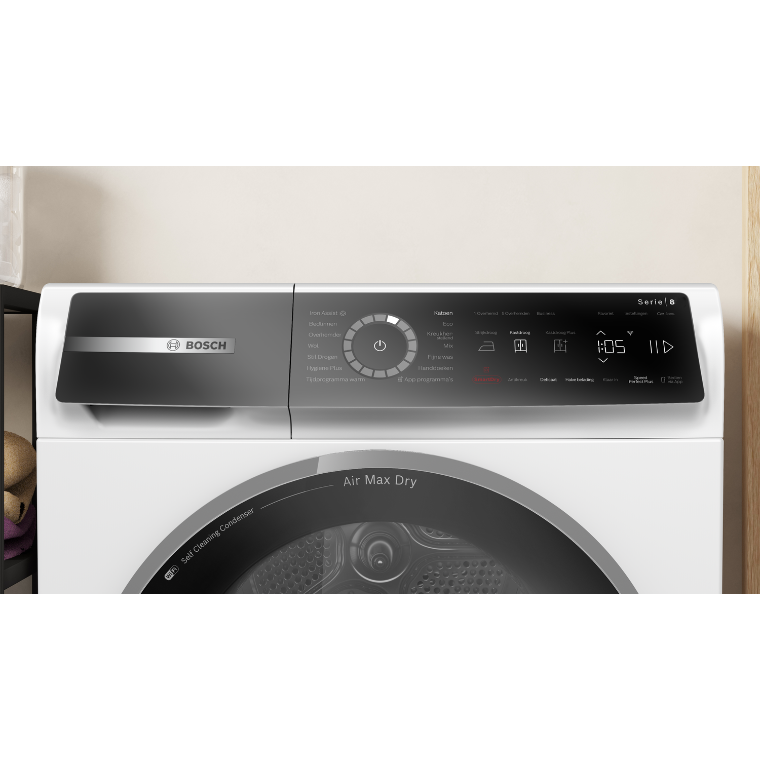 A white Bosch dryer with a black control panel displaying various settings and a digital timer.