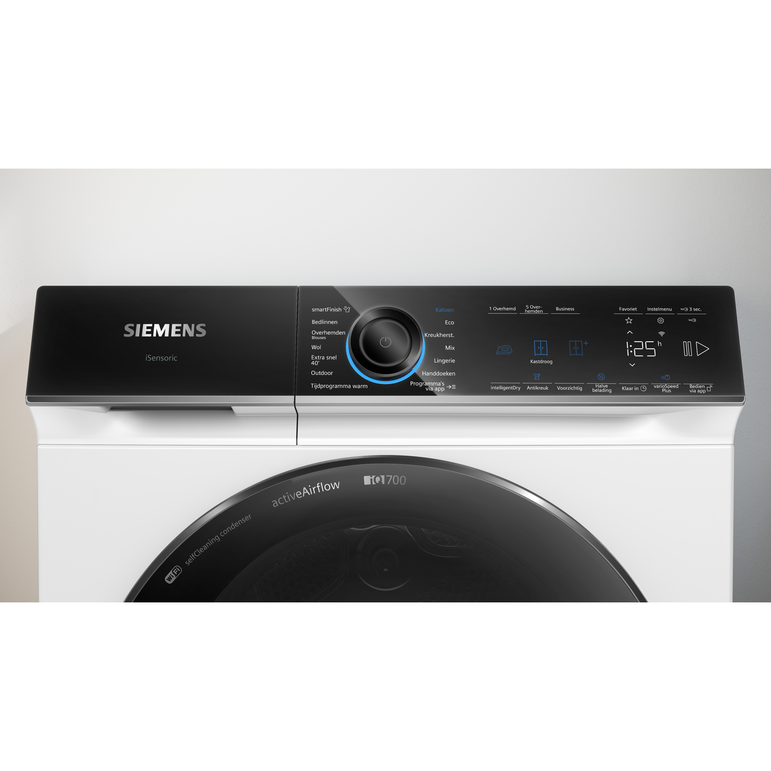 A white Siemens dryer with a black control panel. Buttons and a display show settings. The door is glass.