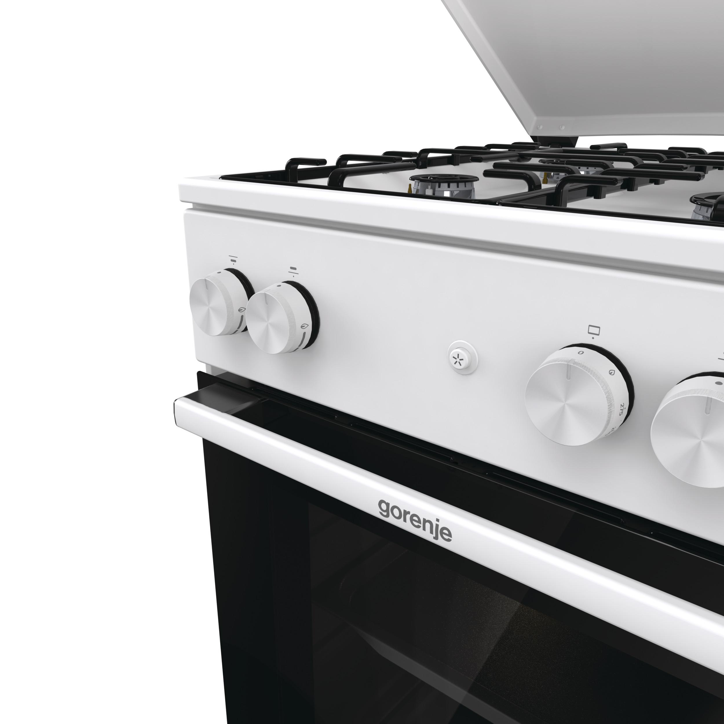 Weißer Gorenje-Ofen mit schwarzen Brennern und Bedienknöpfen. Die Backofentür ist schwarz und hat einen weißen Griff.