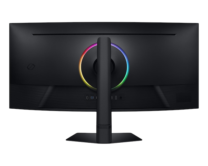 Rückansicht eines schwarzen Computermonitors. Er hat einen Ständer und ein kreisförmiges Licht mit mehreren Farben. Anschlüsse sind unten sichtbar.