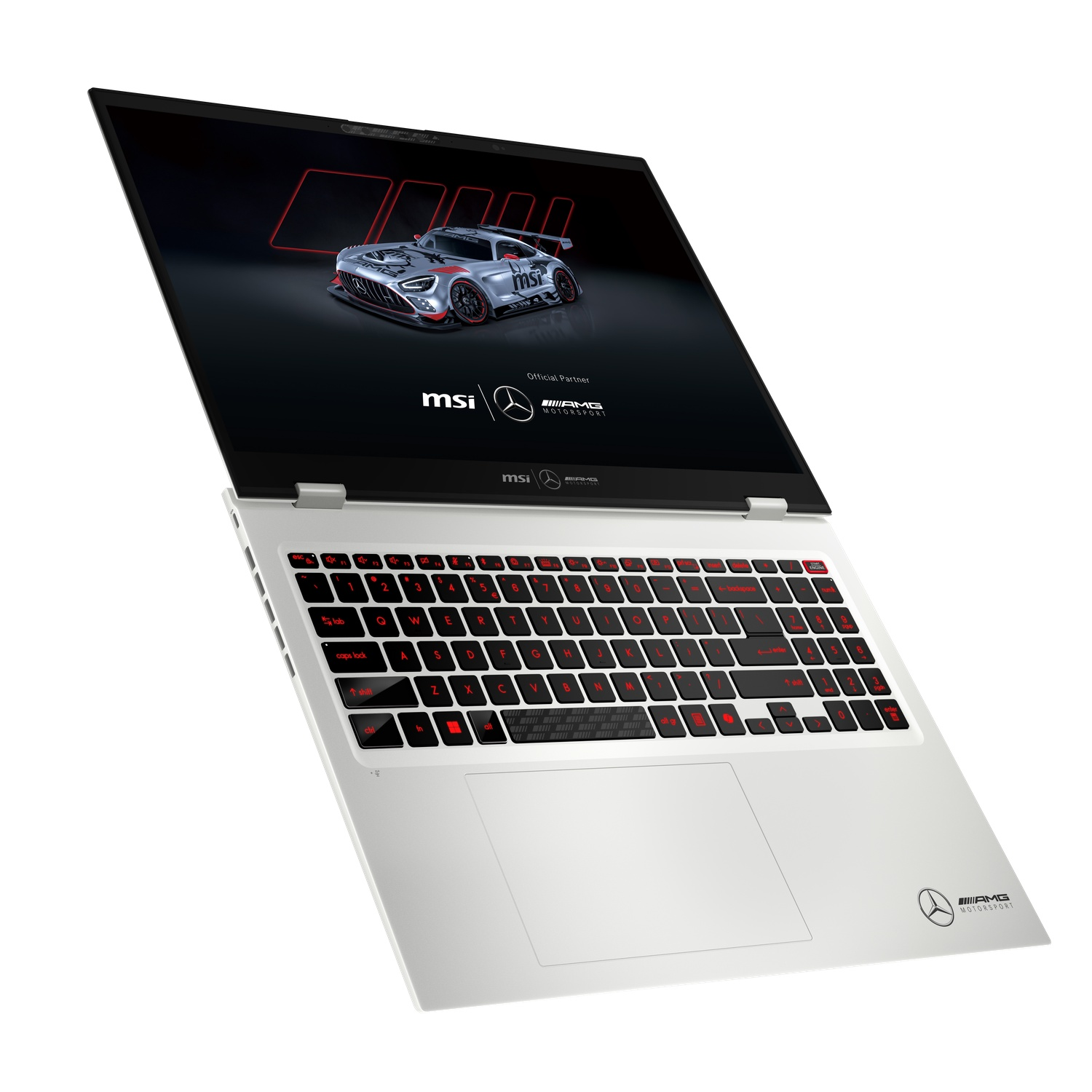 A silver and black MSI laptop is open. The screen displays a race car graphic. The keyboard has red backlit keys. AMG logo is visible.