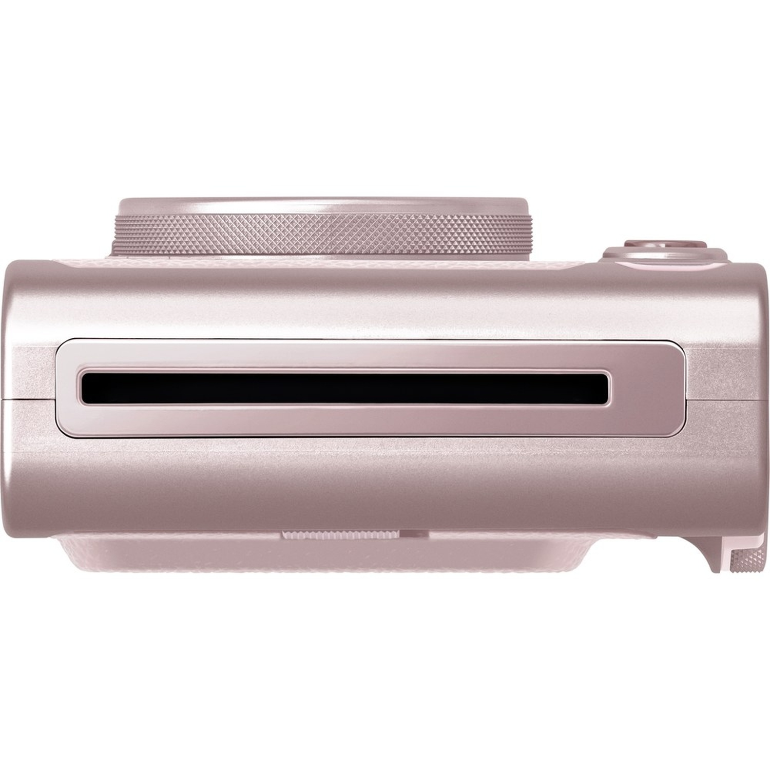 A light pink instant camera, top view. It has a lens, a shutter button, and a slot for the photos. The texture is smooth.
