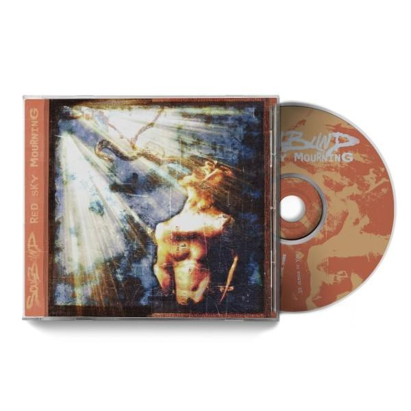 CD-Hülle mit Albumcover mit einer Figur mit Lichtstrahlen. CD mit Albumtitel sichtbar.