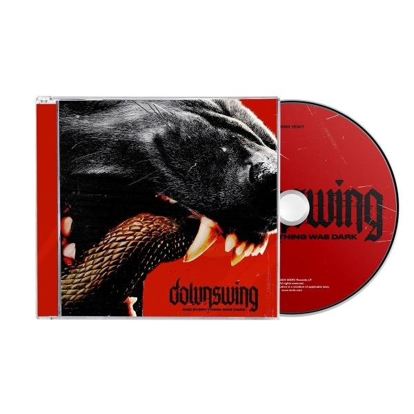 CD-Cover mit schwarzem Hund, der eine Schlange beißt, und einer roten CD.