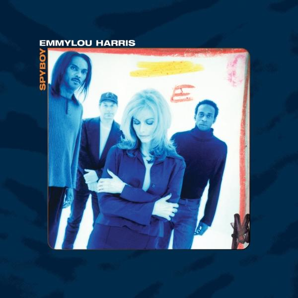 Albumcover mit Emmylou Harris und Band. Gruppe steht vor weißem Hintergrund. Blaue und gelbe Akzente. Albumtitel: Spyboy.