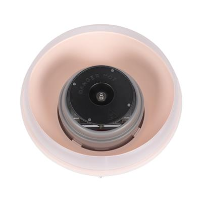 Draufsicht auf eine Zuckerwattemaschine. Sie hat eine rosa Schüssel, eine zentrale schwarze Komponente und einen transparenten Kunststoffrand.