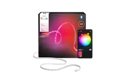 A Philips Hue Flux strip light kit with a smartphone displaying color options and a box with product details. The light is white.