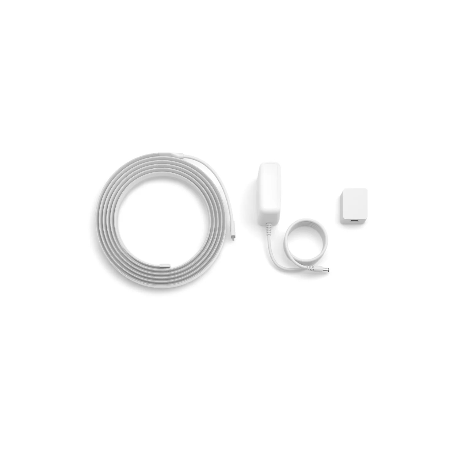 White power adapter, a small square device and a coiled cable on a white background. All elements are white.