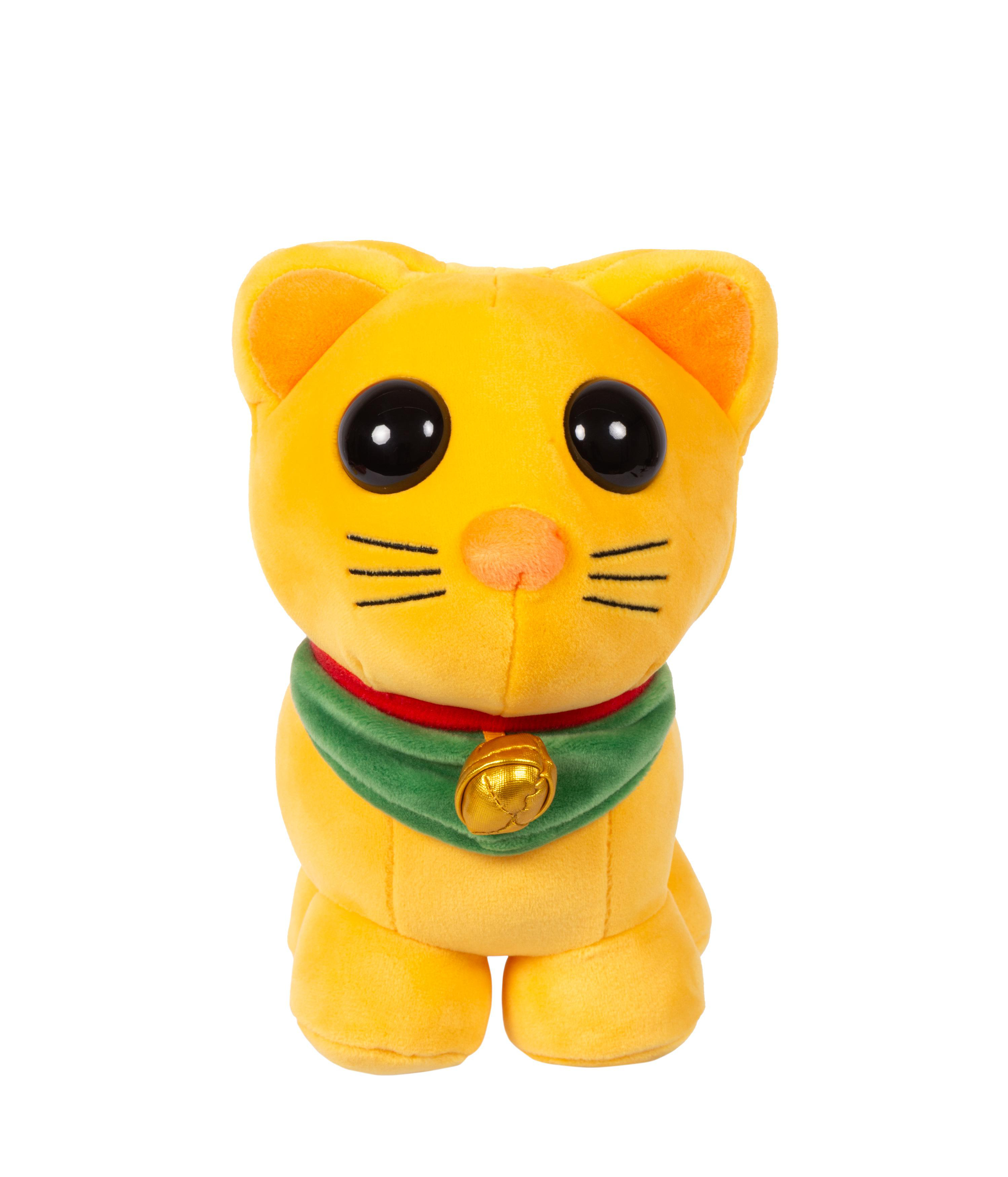 Gelbes Katzenplüschtier mit großen schwarzen Augen und einem grünen Kragen mit goldener Glocke. Es ist vor weißem Hintergrund.