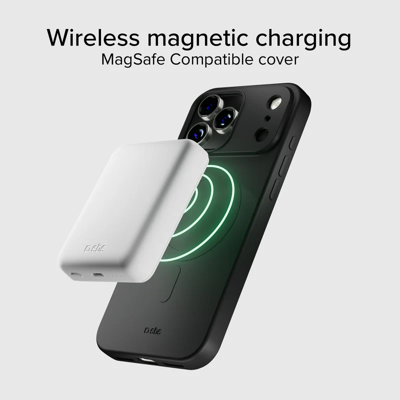 Ein schwarzes iPhone mit einem weißen kabellosen Ladegerät wird gezeigt. Das Ladegerät befindet sich in der Nähe des Telefons, mit einem grün leuchtenden Kreis.