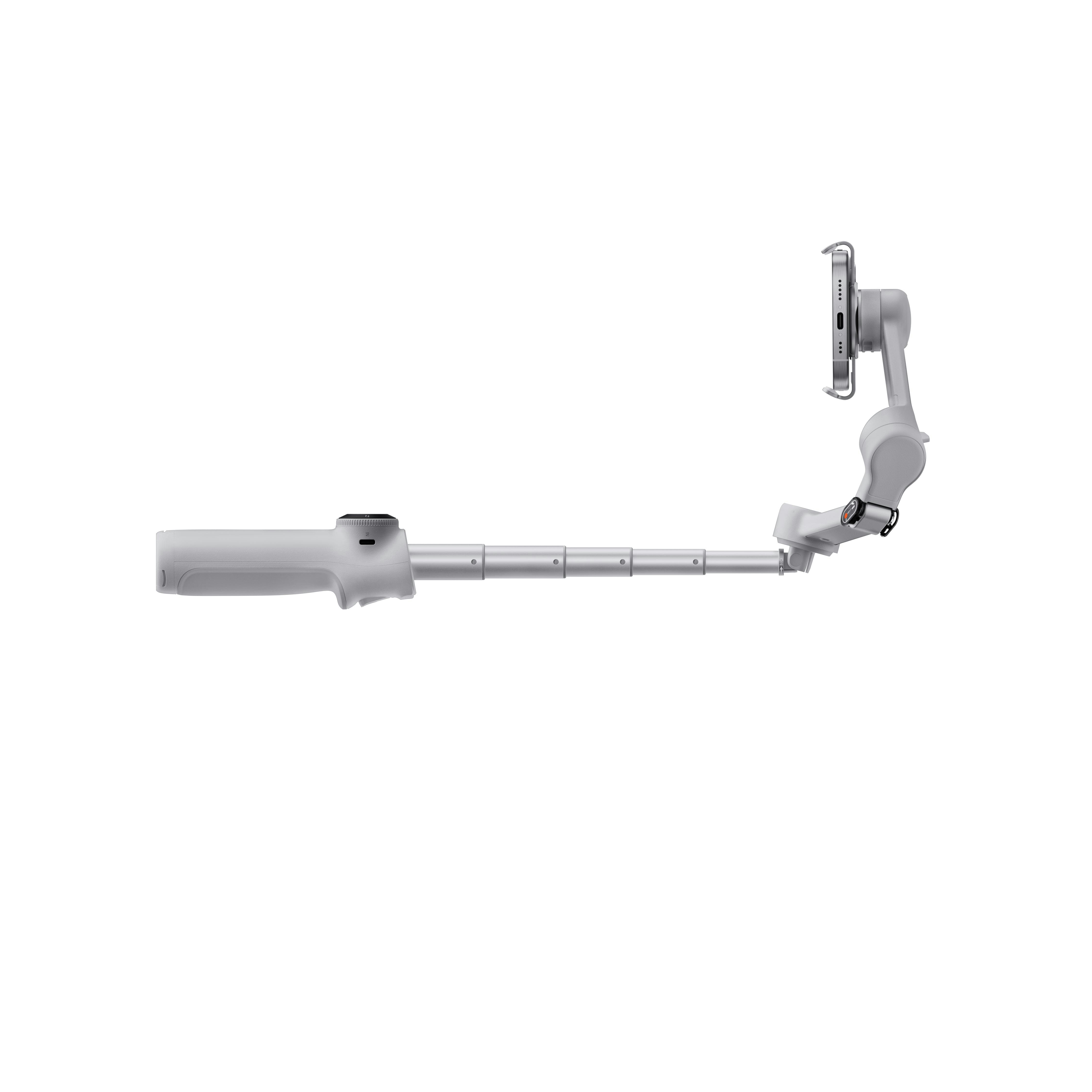 Ein weißer Smartphone-Stabilisator mit befestigtem Telefon. Er hat einen ausziehbaren Arm und einen Griff.