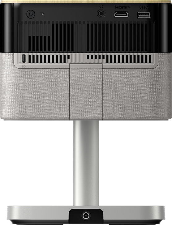 Ein Projektor mit grauem Stoffgehäuse, schwarzer Oberseite mit Anschlüssen und einem Ständer. Anschlüsse umfassen HDMI, USB und Strom.