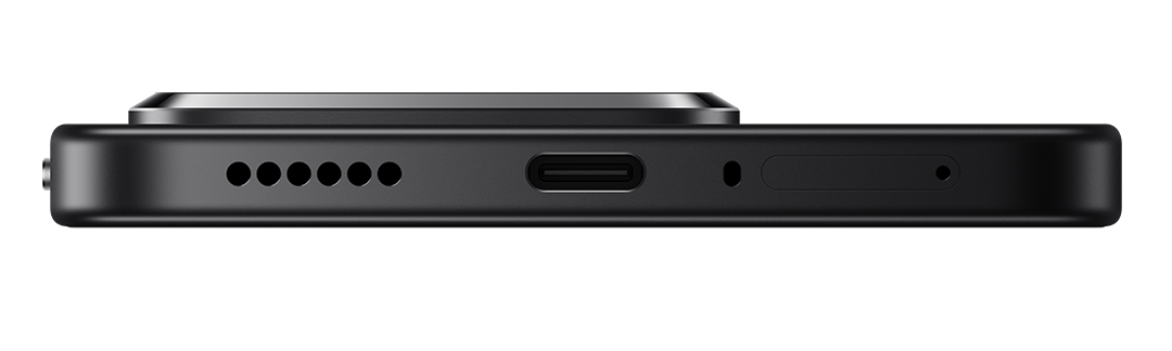 Egy fekete telefon alsó szélének közeli képe. Hangszórólyukak, USB-C port és mikrofon látható.