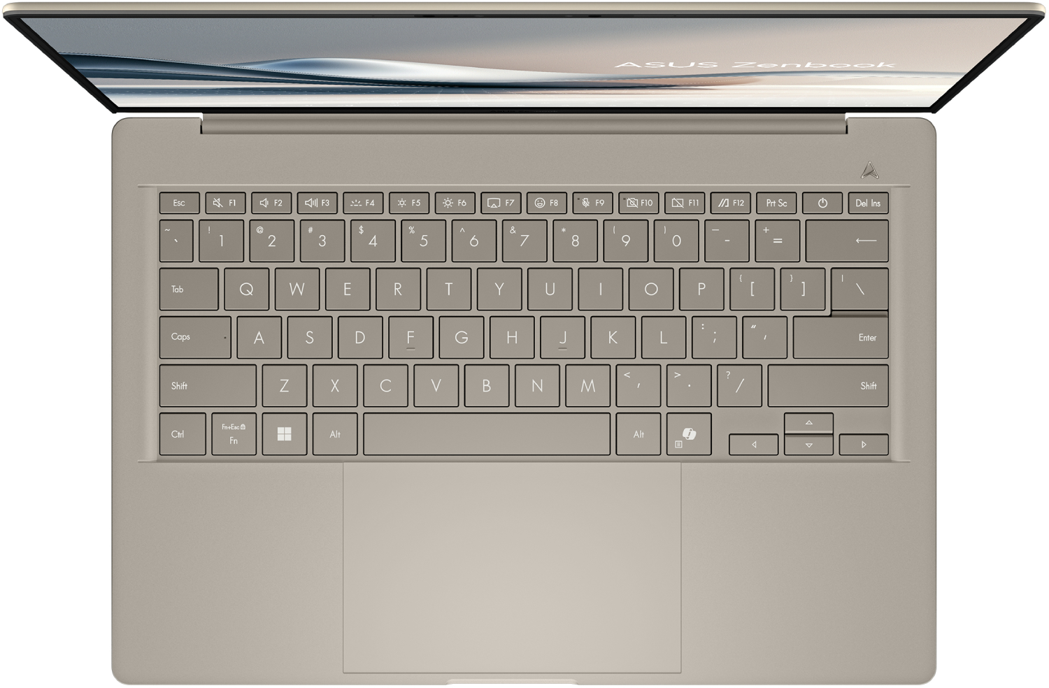 Vista superior de una laptop ASUS Zenbook beige abierta. Teclas del teclado visibles. La pantalla muestra una imagen borrosa.