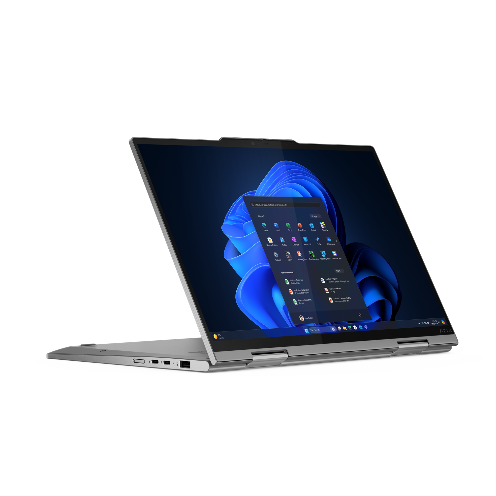 Silberner Laptop mit Windows-Oberfläche auf dem Bildschirm, vor schwarzem Hintergrund. Auf dem Bildschirm sind App-Symbole zu sehen.