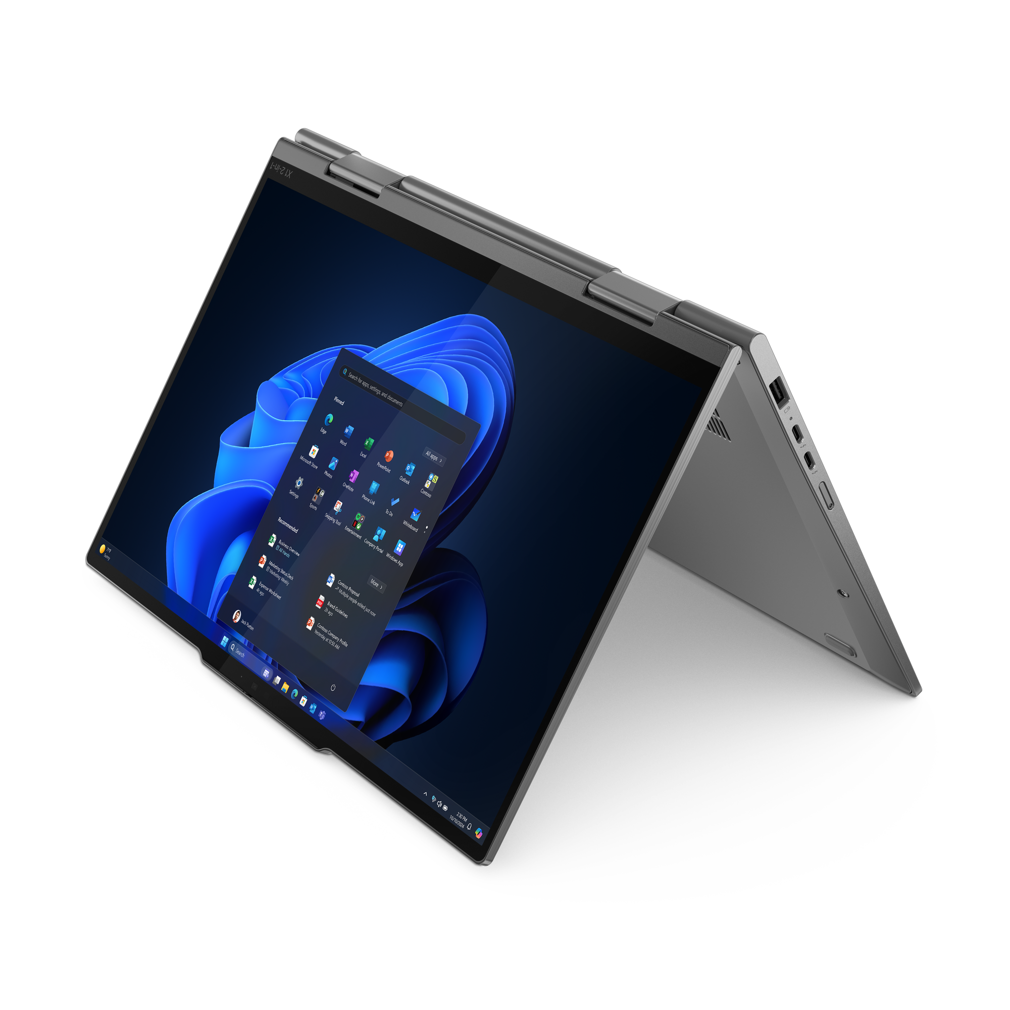 Ein grauer Laptop ist geöffnet und zeigt die Windows 11-Oberfläche mit verschiedenen App-Symbolen und blauem Hintergrund.