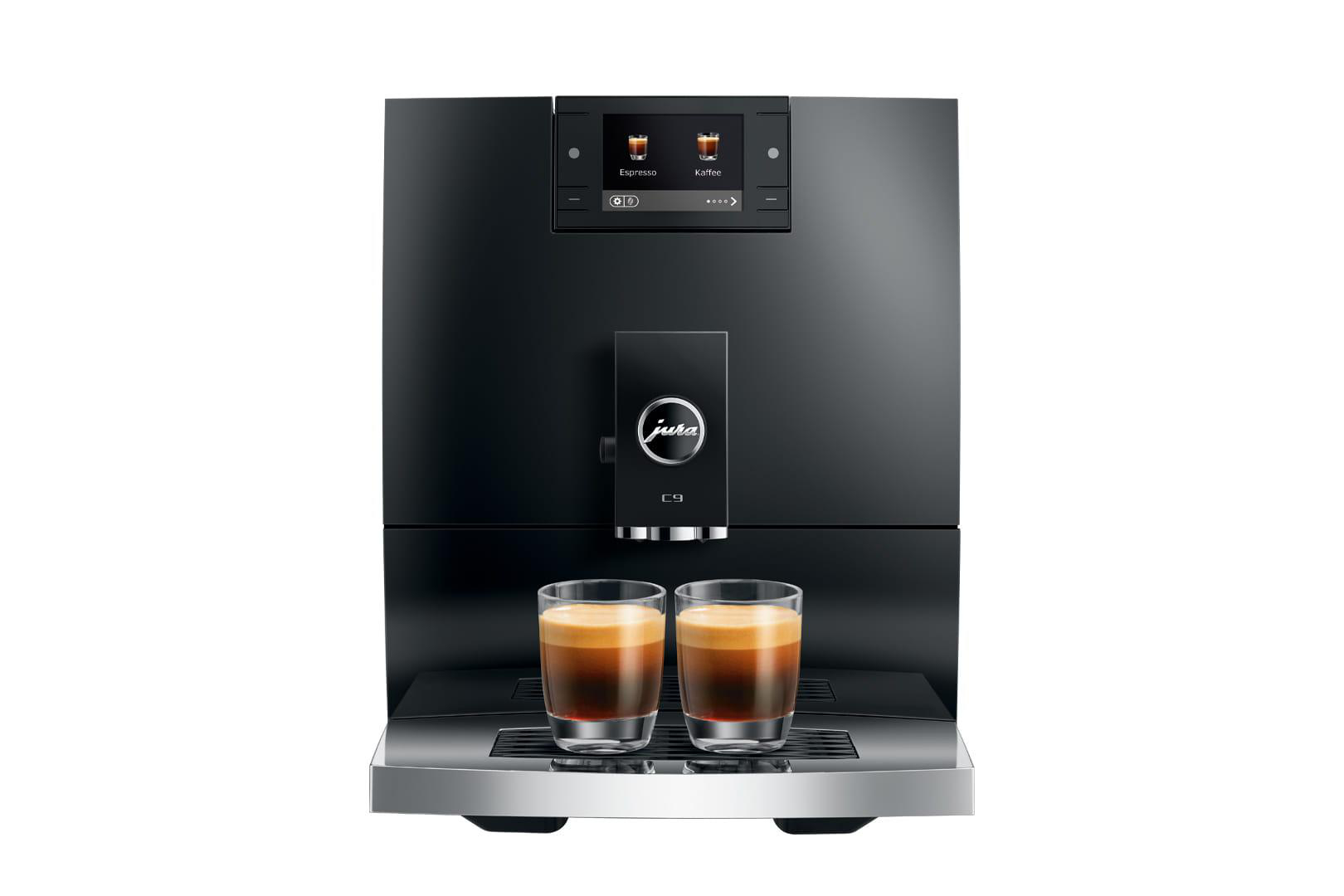 Eine schwarze Jura E9 Espressomaschine. Zwei Espressogläser stehen darunter. Die Maschine hat einen Bildschirm mit Espresso- und Kaffee-Symbolen.