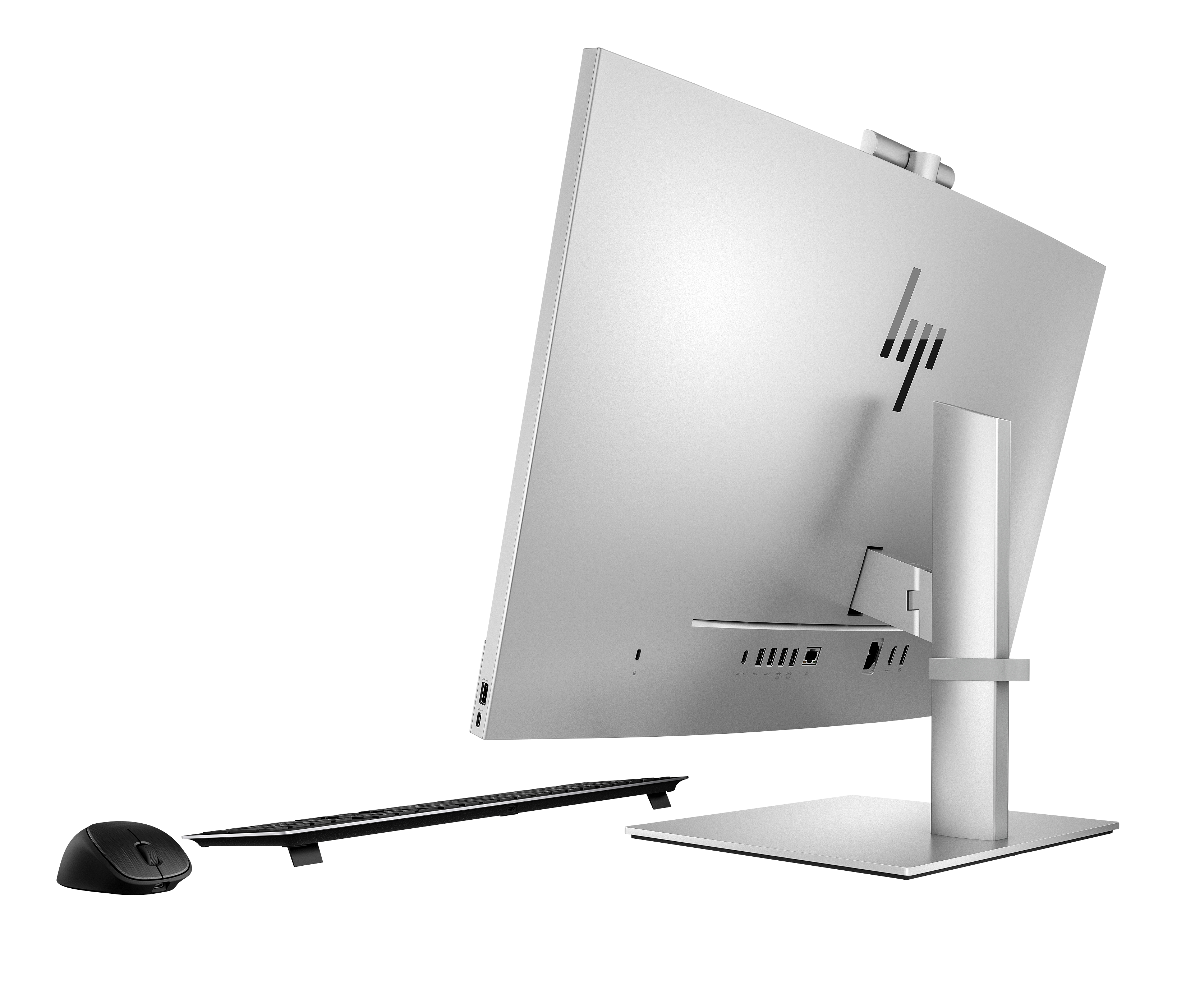 Ein silberner HP All-in-One-Computer auf schwarzem Hintergrund, mit Tastatur und Maus.