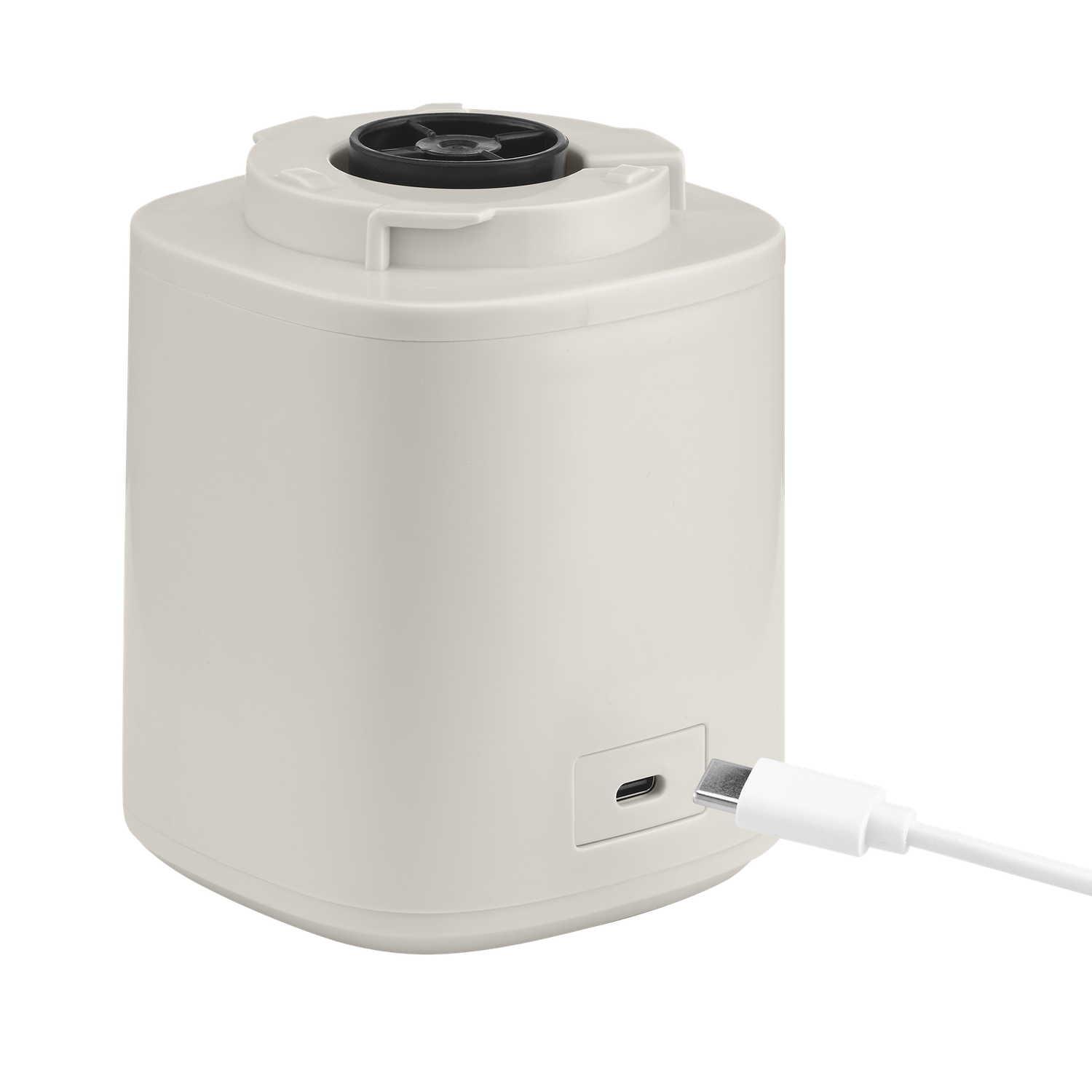 A beige cylindrical device with a black top and a white USB-C cable plugged in. The background is black.