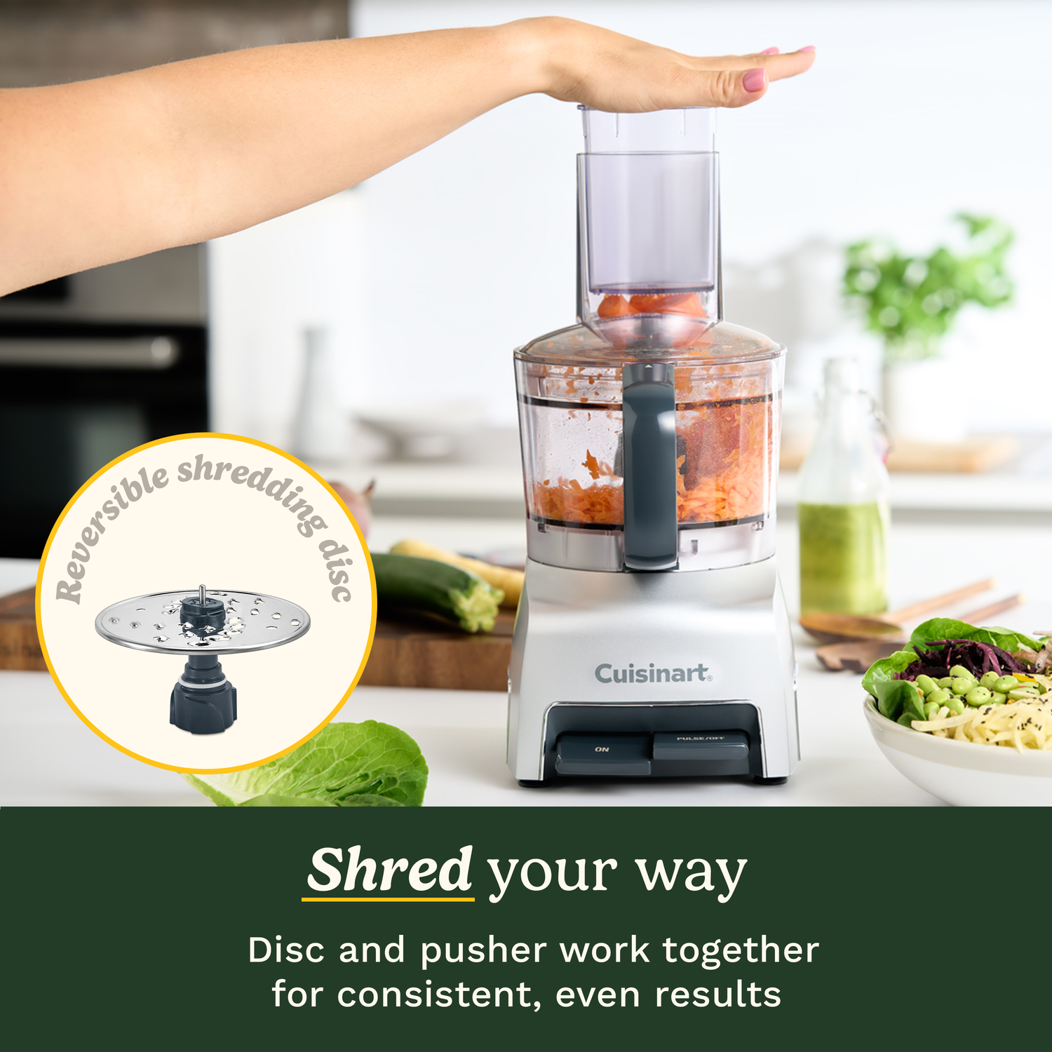 A woman's hand placing vegetables into a Cuisinart food processor. A reversible shredding disc is shown. A bowl of salad is in the background.