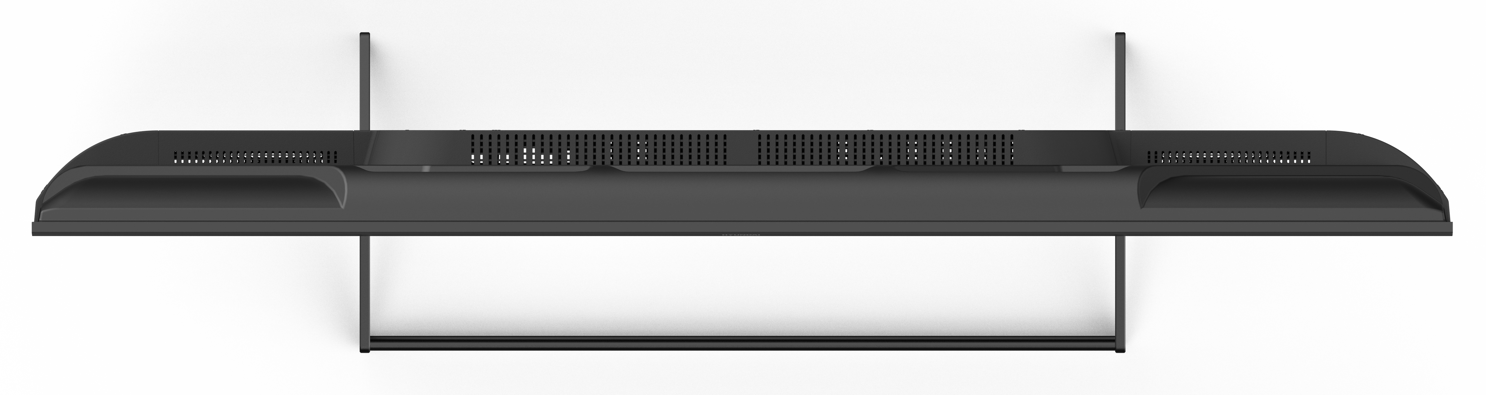 Widok z góry na czarne prostokątne urządzenie. Ma otwory wentylacyjne i zakrzywioną górę. Jest na białym tle.