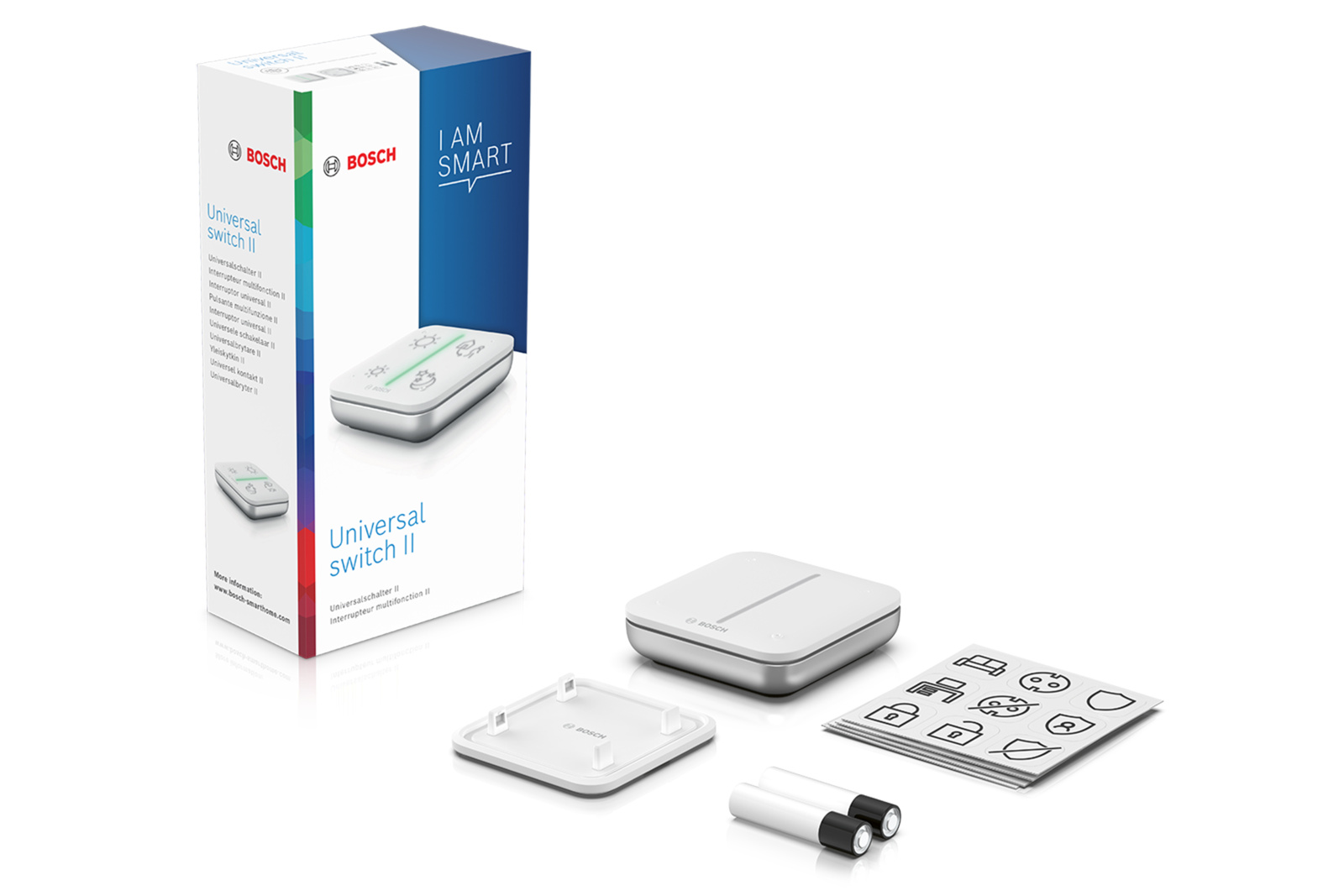 Ein weißes Bosch Universal Switch II-Kit. Enthält Schalter, Karton, Abdeckung, Aufkleber und Batterien auf weißem Hintergrund.