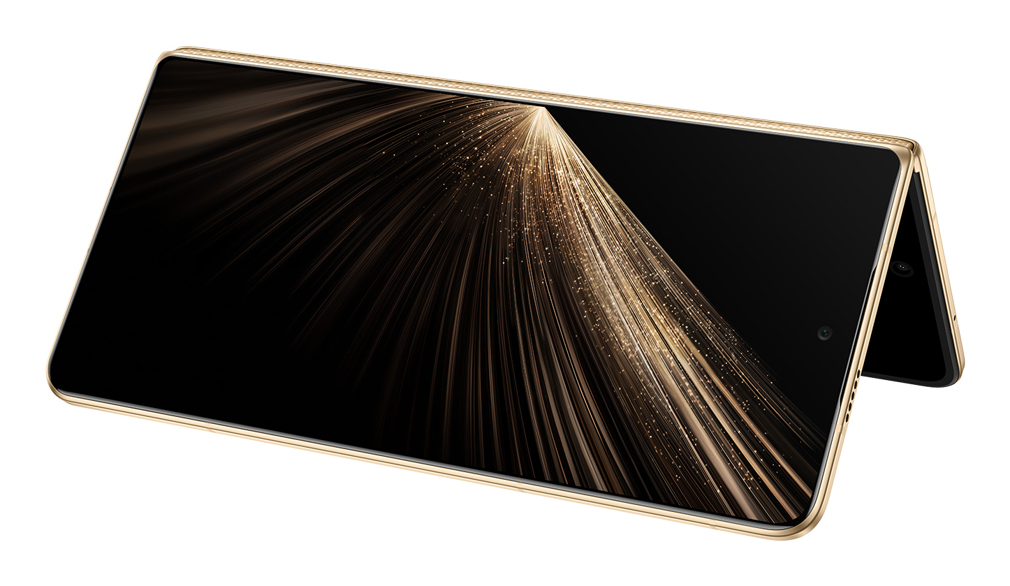Un teléfono inteligente plegable dorado con una pantalla negra que muestra un efecto de luz dorada. El fondo es blanco.