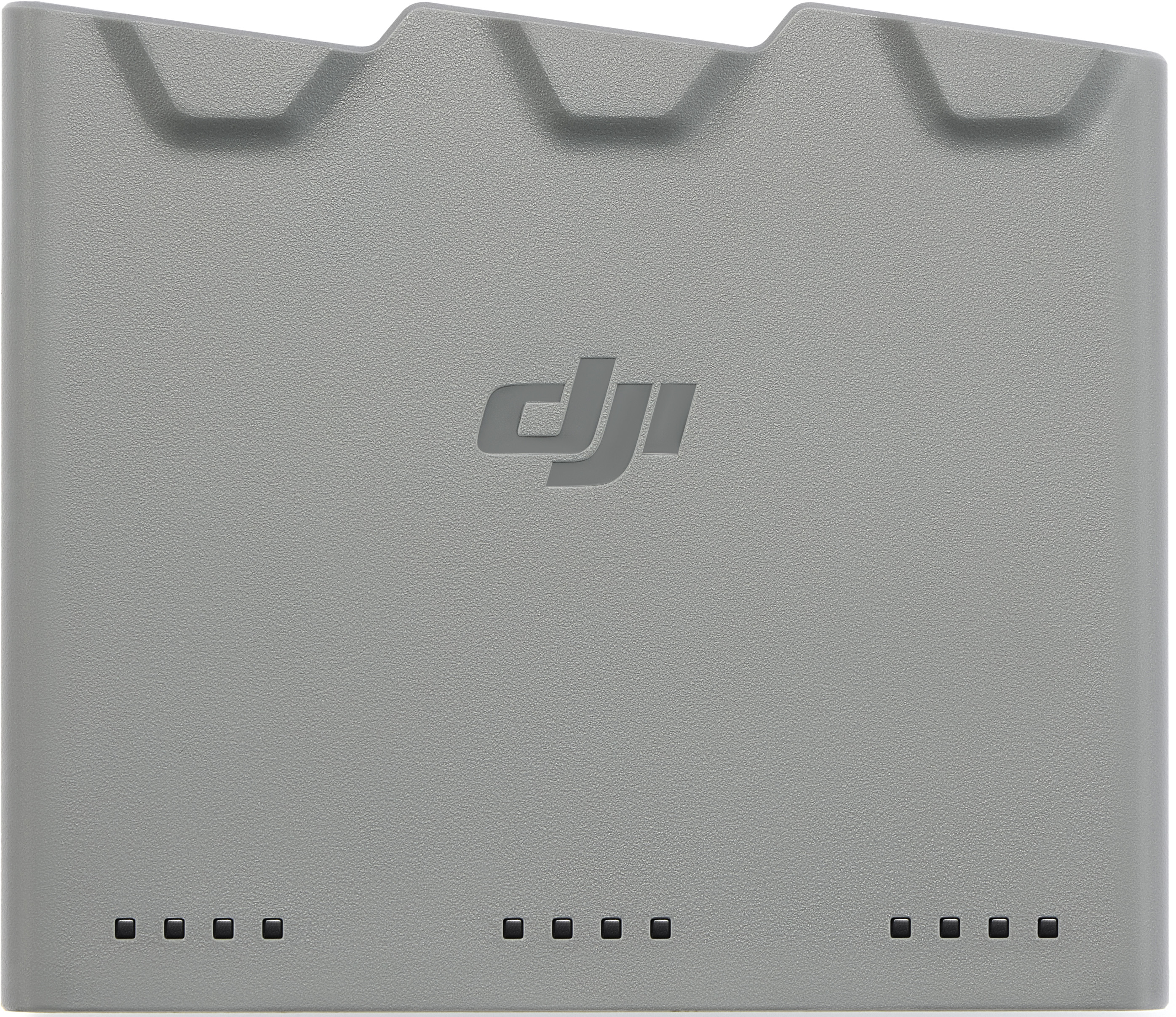 Chargeur de batterie de drone DJI gris. Il porte le logo DJI et quatre voyants. Le haut comporte trois renfoncements incurvés.