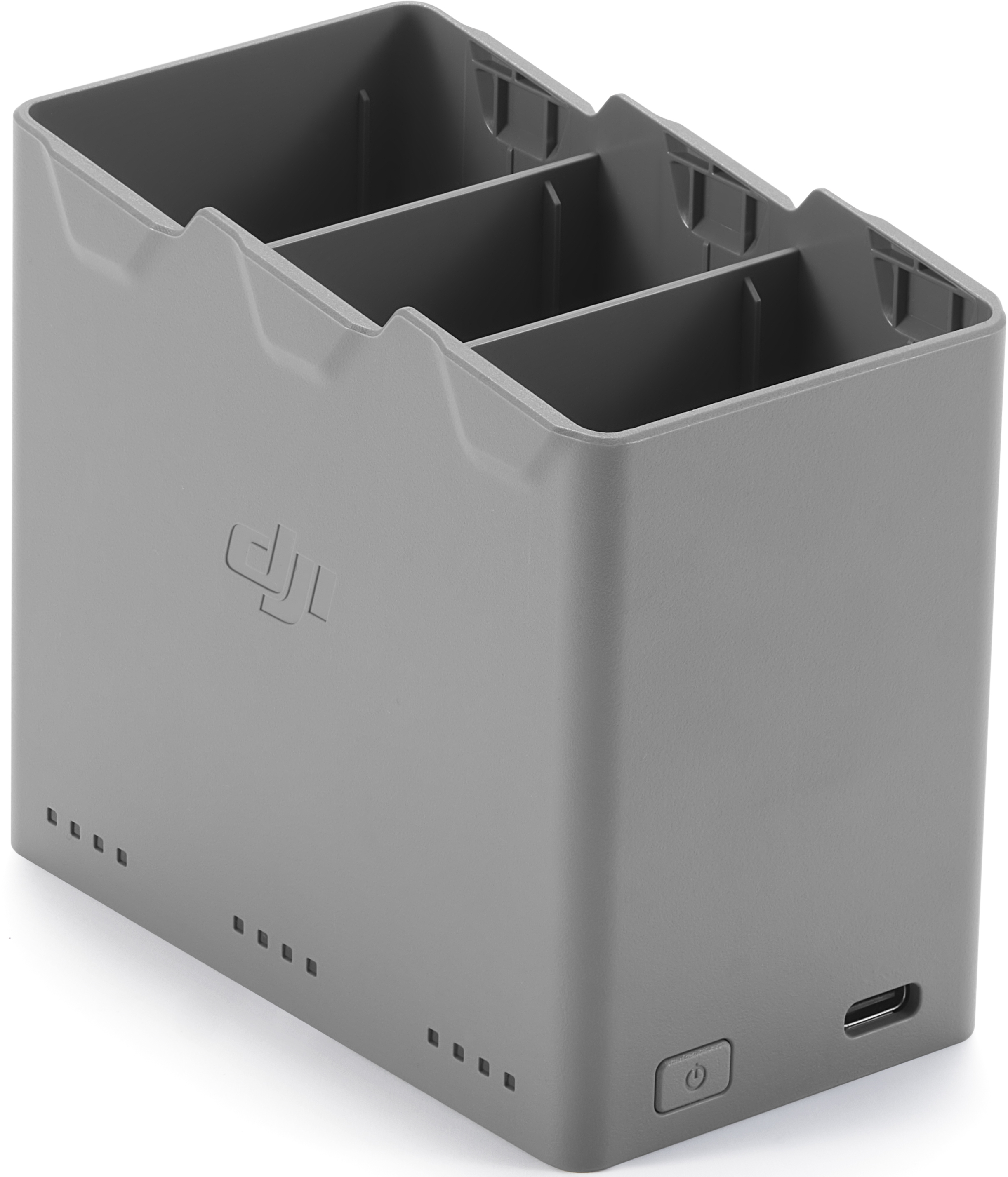 Station de charge de batterie de drone DJI en plastique gris, avec trois emplacements, un bouton d'alimentation et un port USB.