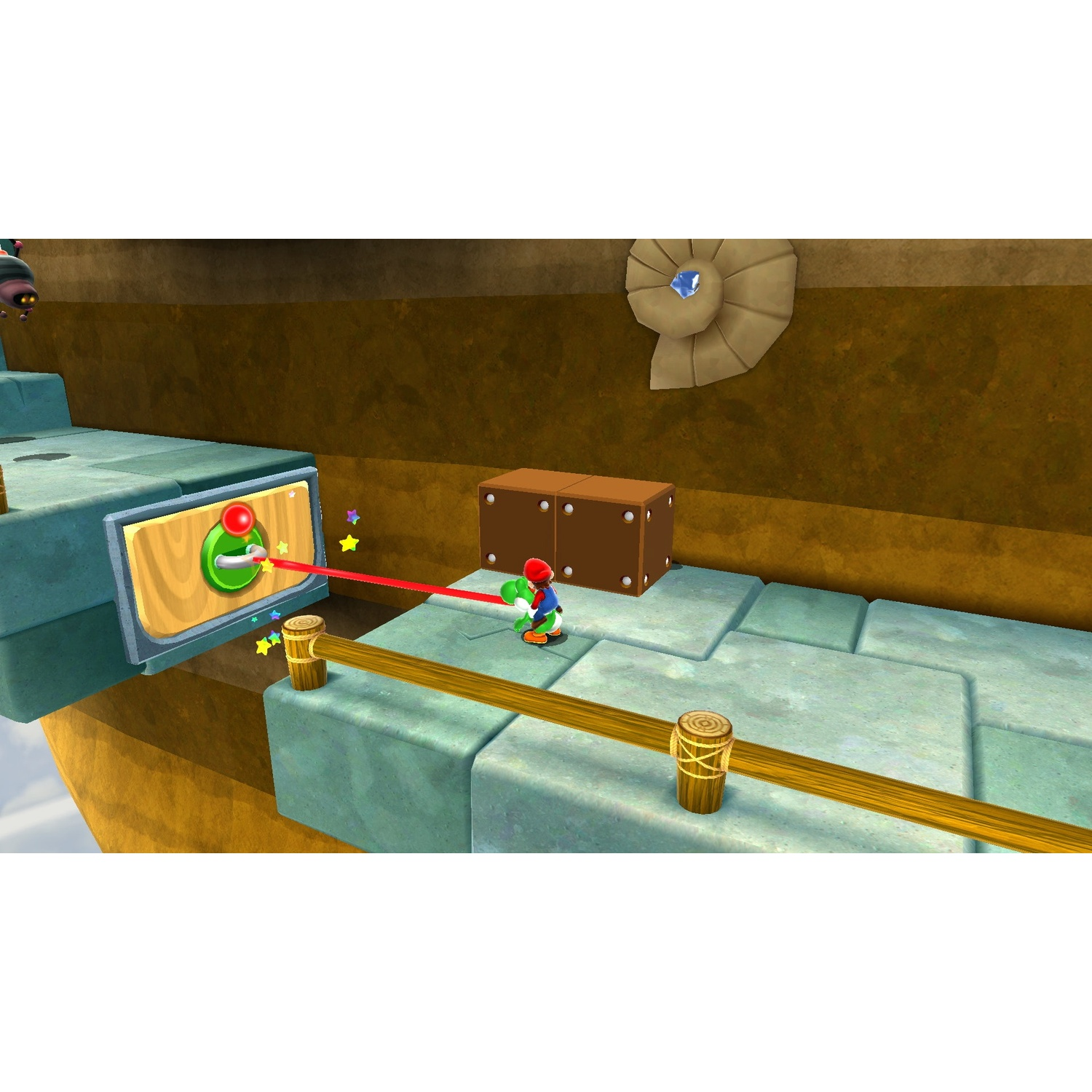 Yoshi in una scena di gioco. C'è un interruttore con un raggio rosso, una scatola marrone e una decorazione murale. La scena è luminosa e vibrante.