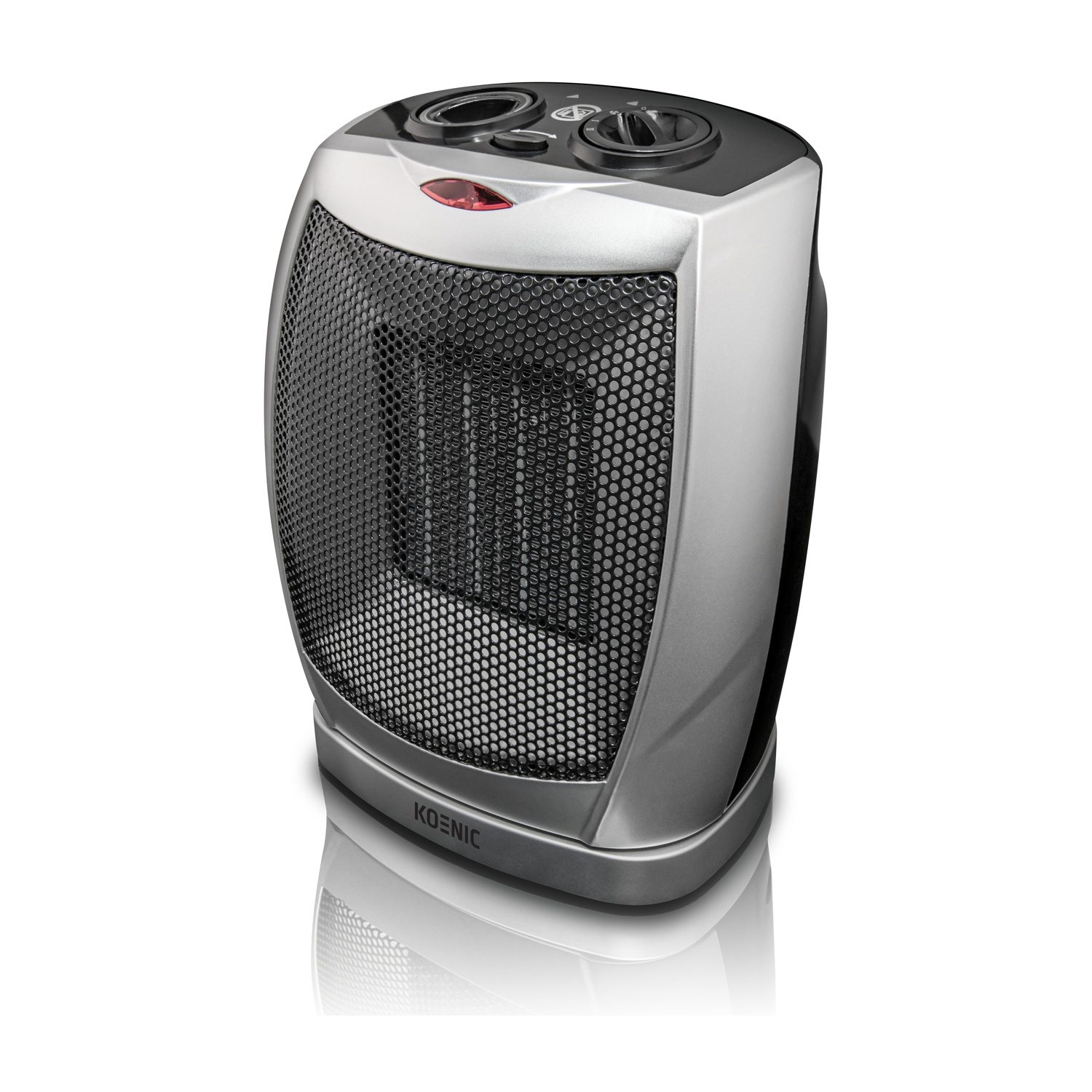 Un termoventilatore elettrico Koenic argento e nero. Ha un frontale a rete, manopole di controllo e una spia rossa. Si trova su una superficie bianca.