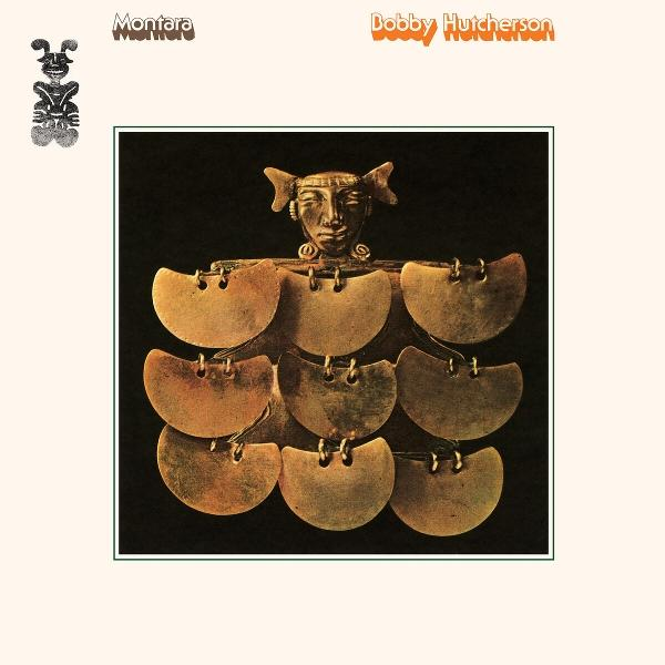 Album borító: arany figura fejjel, kis fülekkel és sok korong alakú elemmel. Sötét háttér. Szöveg: Montara, Bobby Hutcherson.