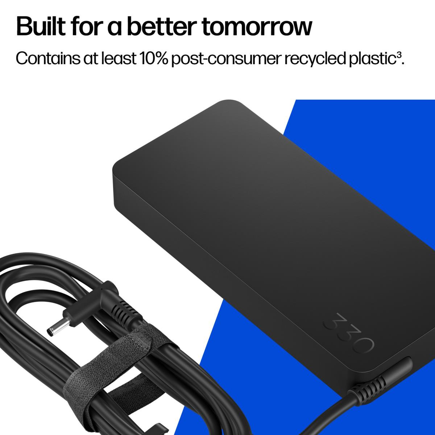 A black laptop power adapter with the number 330 on it. Black power cable is neatly wrapped. Text says 'Built for a better tomorrow'.