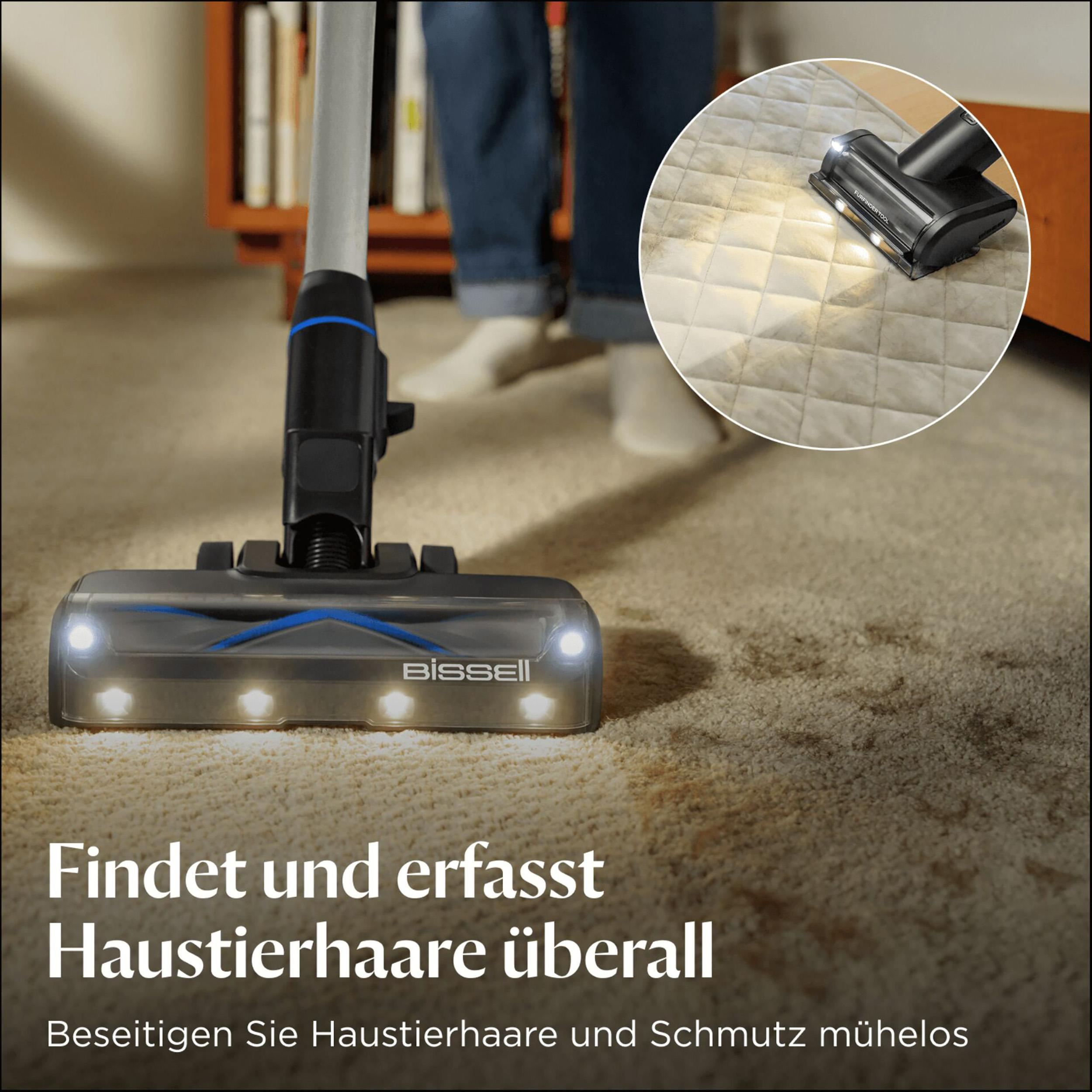 Ein Staubsauger mit Lichtern befindet sich auf einem Teppich. Eine Nahaufnahme zeigt den Staubsauger, der eine gemusterte Oberfläche reinigt.