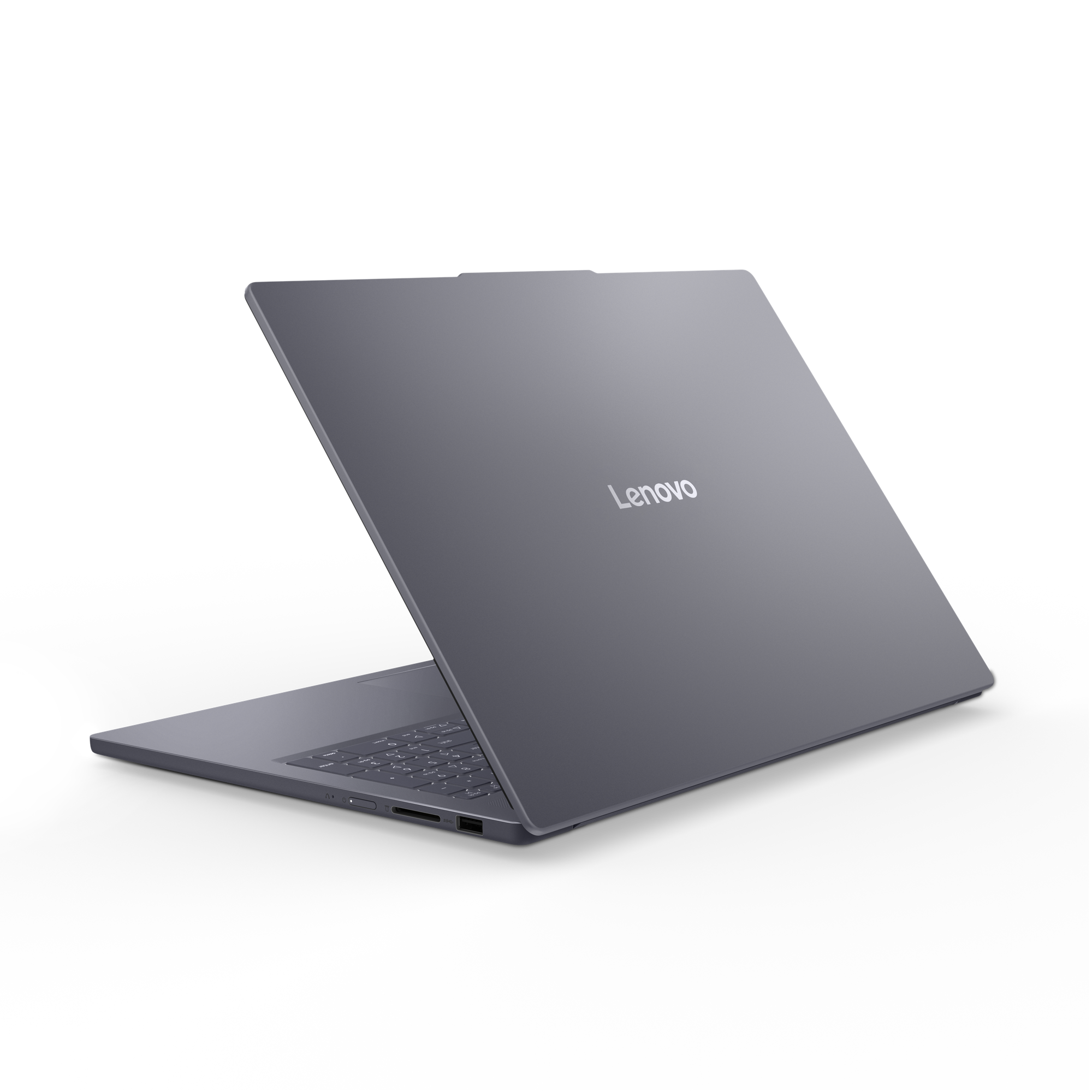 Un ordinateur portable Lenovo gris, ouvert en angle. Le logo Lenovo est visible. Fond noir.