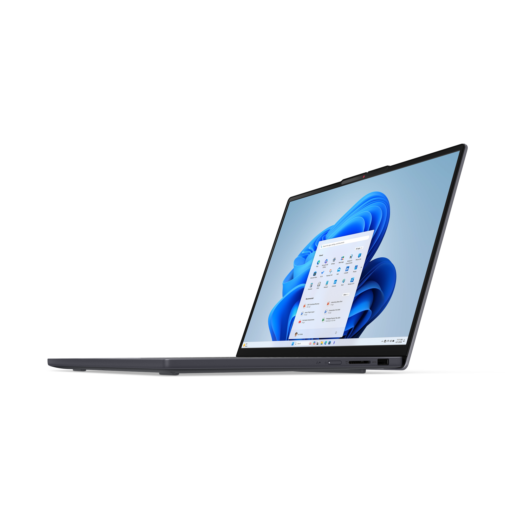 Ordinateur portable sur fond noir, écran Windows 11. Fond d'écran bleu, icônes d'applications ouvertes.