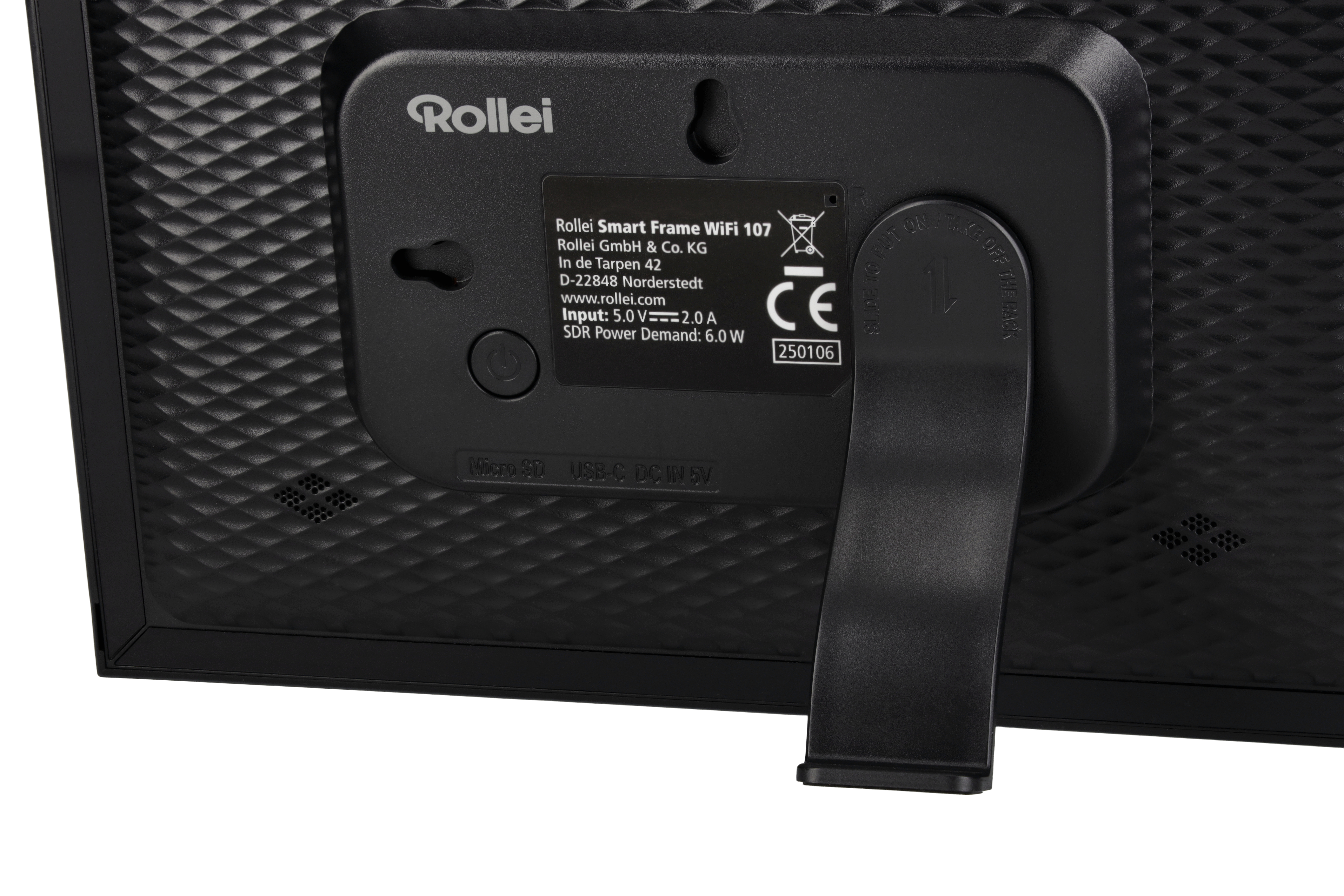 Schwarze Rückseite des Rollei Smart Frame mit Ständer. Details umfassen Spezifikationen, Anschlüsse und CE-Kennzeichen.