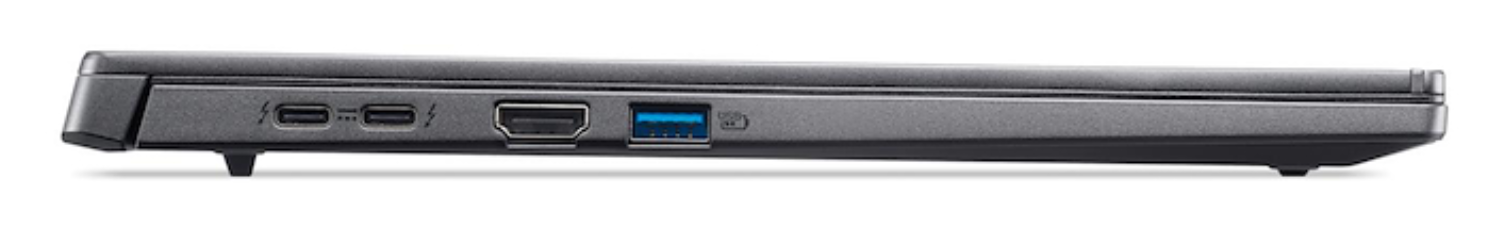 Vista lateral de una laptop gris oscura. Puertos visibles: dos USB-C, HDMI y USB-A. La laptop está sobre una superficie blanca.