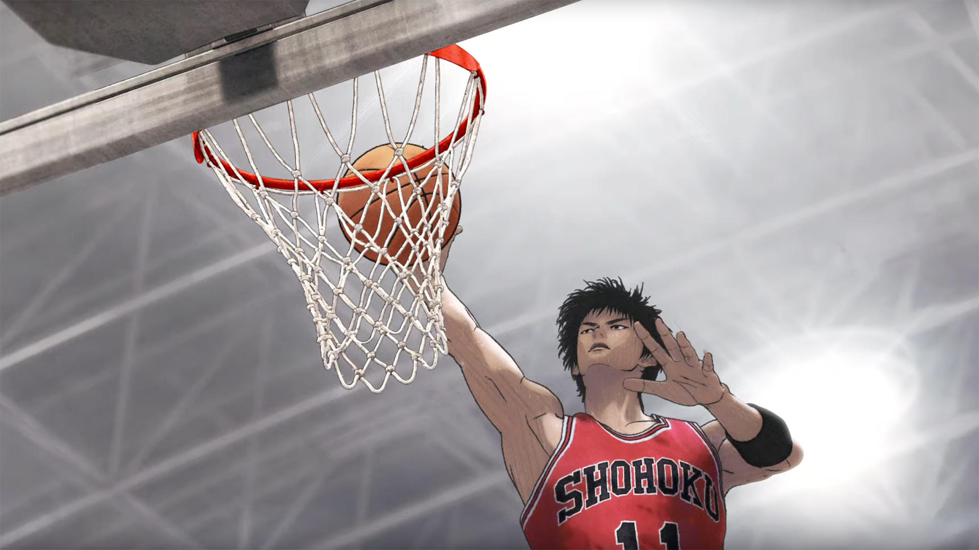 Ein Basketballspieler dunkt den Ball. Der Ball geht in den Korb. Der Spieler trägt ein rotes Trikot mit 'SHOHOKU'.