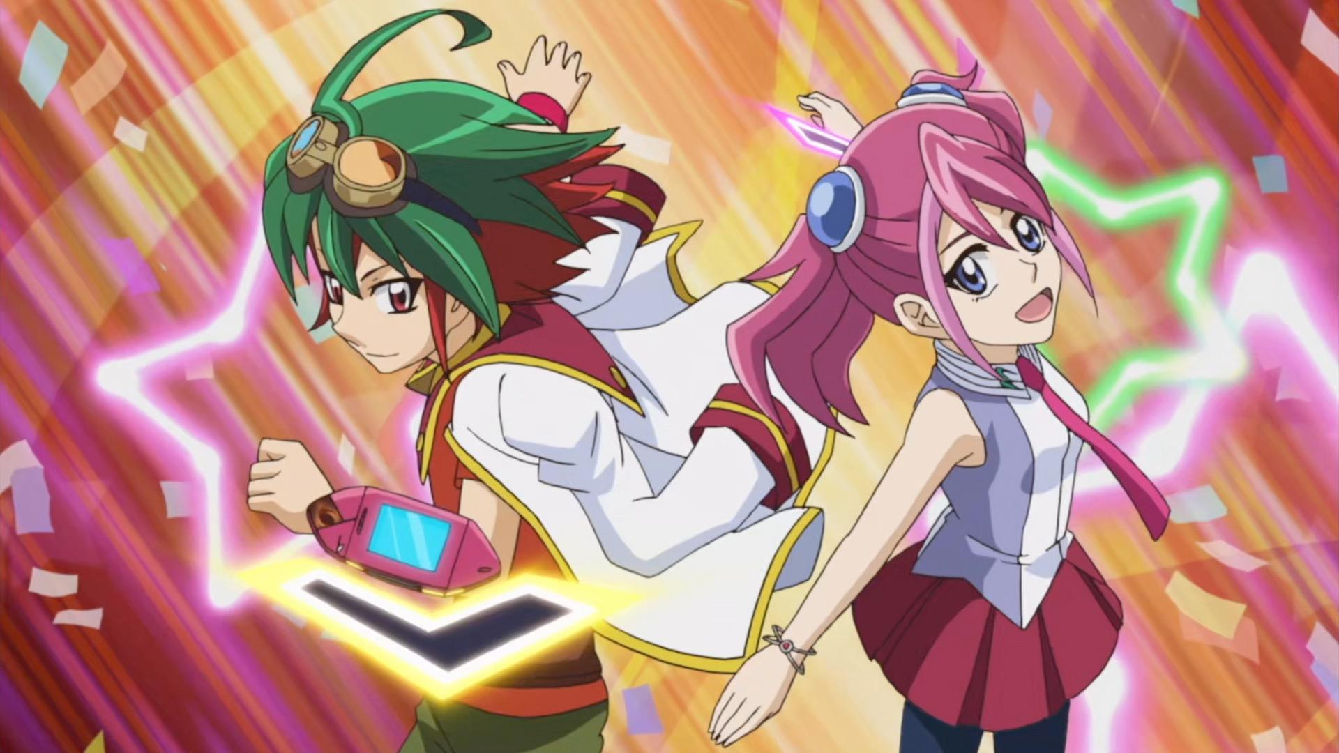 Zwei Anime-Charaktere mit grünem und rosa Haar. Einer mit Brille und Gerät. Animierter Hintergrund mit Sternen und Konfetti.