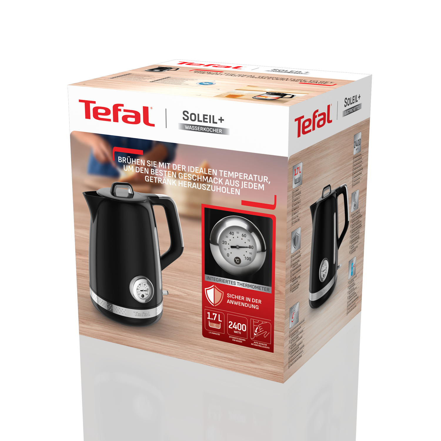 A black Tefal electric kettle is displayed on a box. The box has text and images showing the kettle's features.