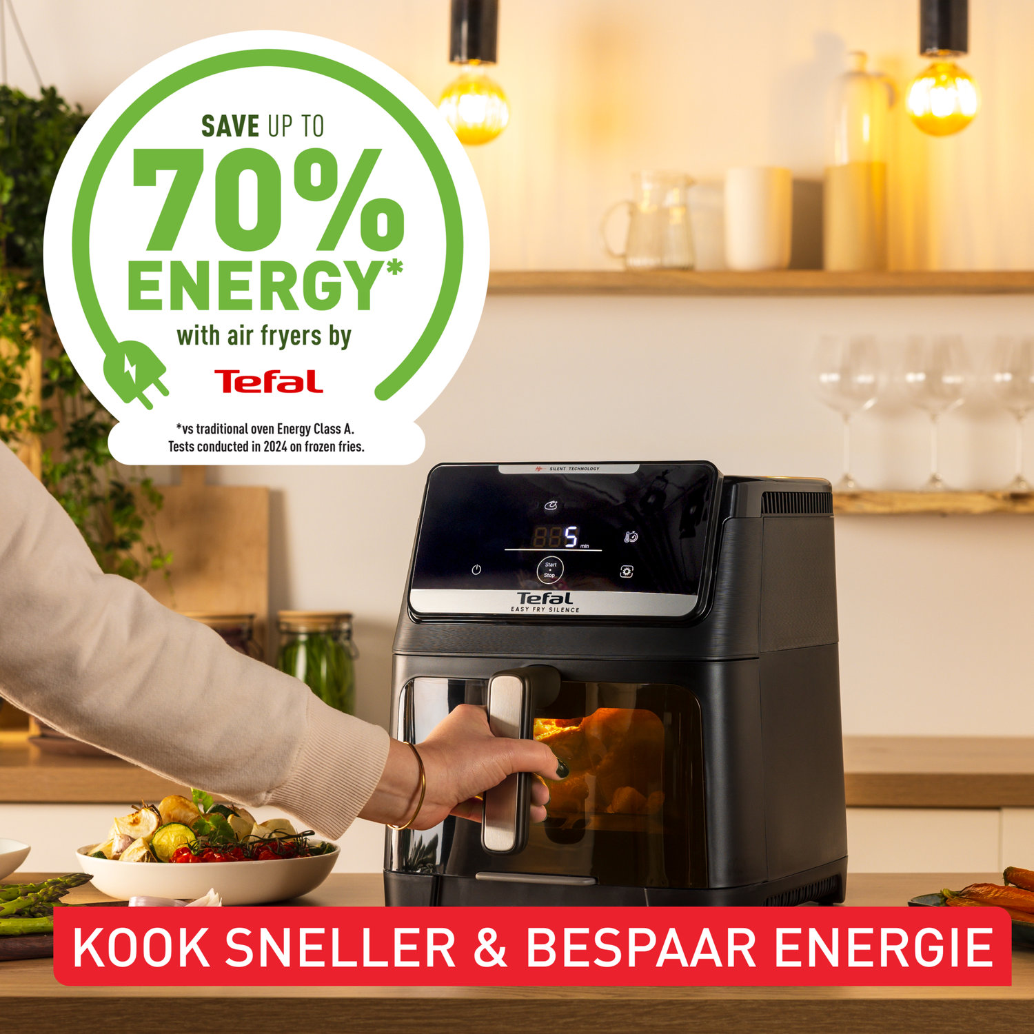An air fryer with food inside is shown, a hand opens it. A sign indicates 70% energy saving. Text reads: Cook faster & save energy.