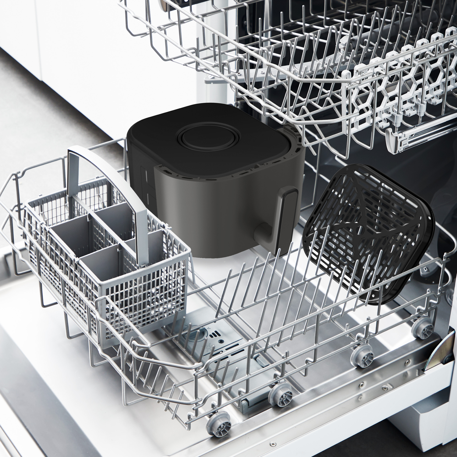 An air fryer and its basket are placed in a dishwasher. A utensil basket sits on the bottom rack. The dishwasher is open.