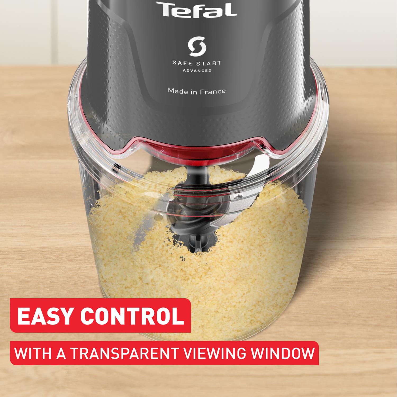A Tefal food chopper with a transparent bowl filled with yellow food. The text 'Easy Control' is at the bottom.