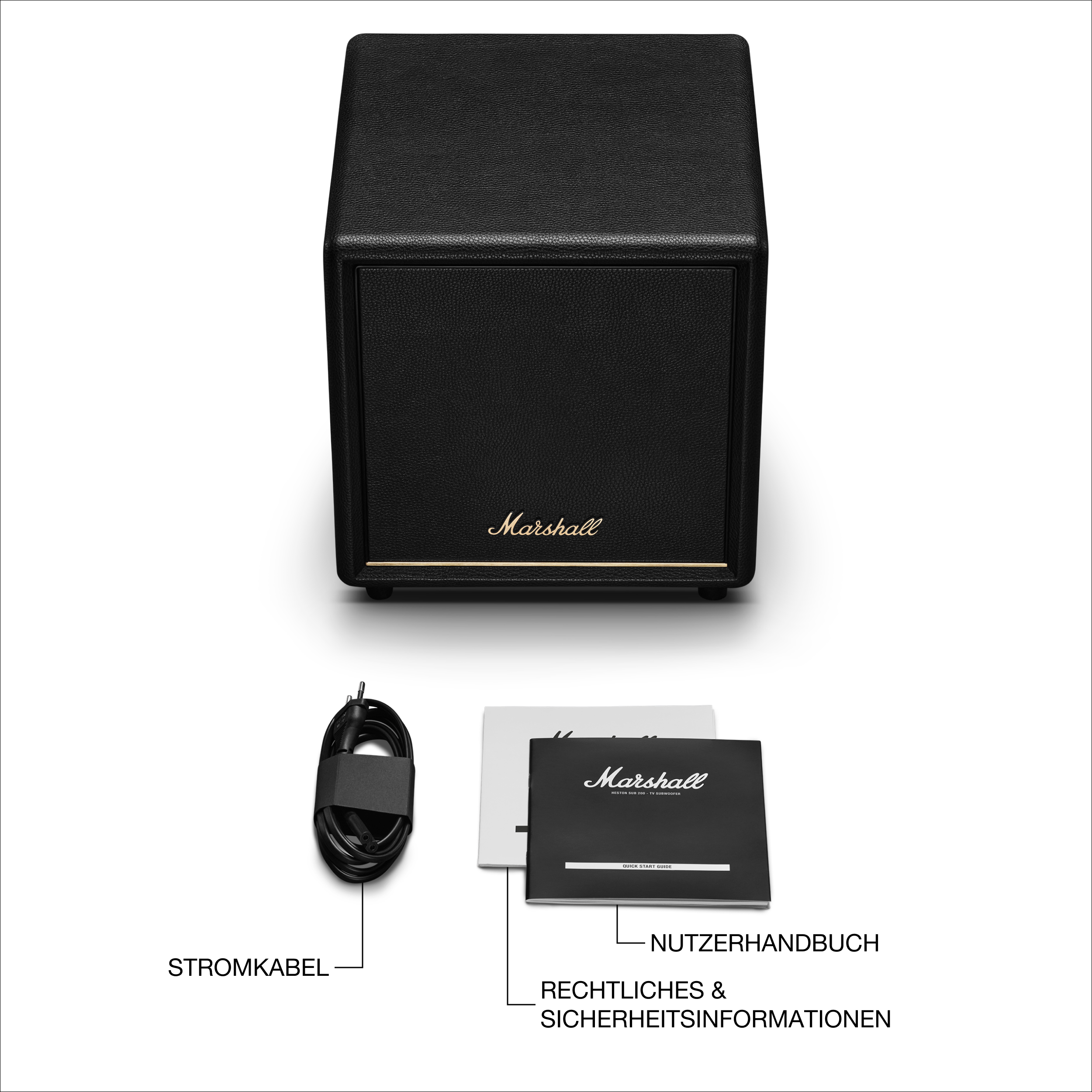 Schwarzer Marshall-Lautsprecher, Netzkabel und Dokumente auf weißer Oberfläche. Der Lautsprecher hat ein goldenes Marshall-Logo.