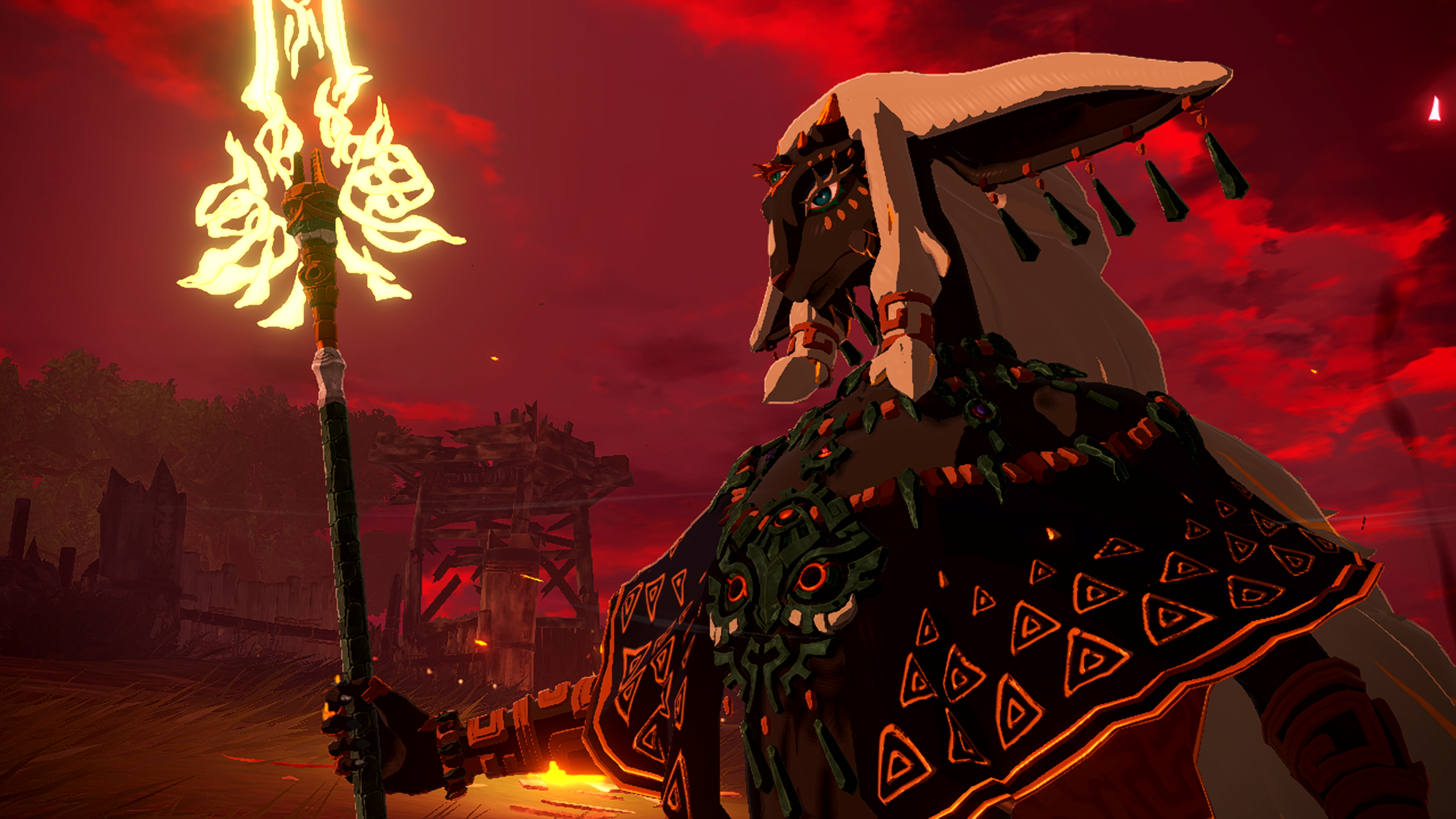 Une figure avec un bâton brillant se dresse devant un ciel rouge. La figure est ornée de vêtements tribaux, et une structure est visible en arrière-plan.