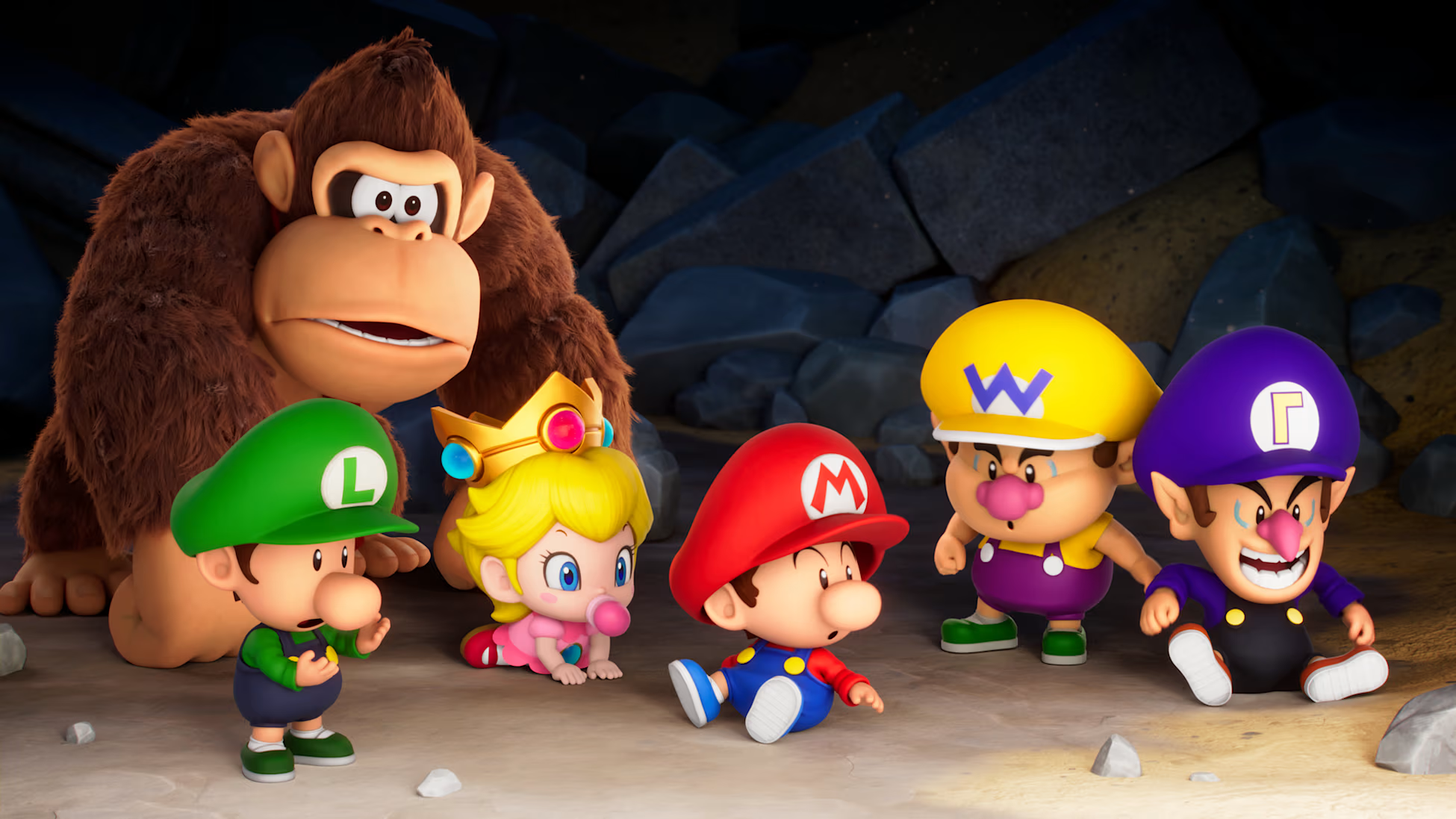 Donkey Kong è in piedi dietro Baby Luigi, Peach, Mario, Wario e Waluigi. Sono in un ambiente di caverna con pareti di pietra.