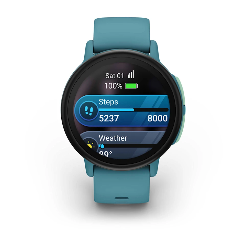 Eine türkisfarbene Smartwatch zeigt Schritt-, Akku- und Wetterinformationen an. Die Uhr zeigt 5237 Schritte von 8000 an, und es sind 29 Grad.