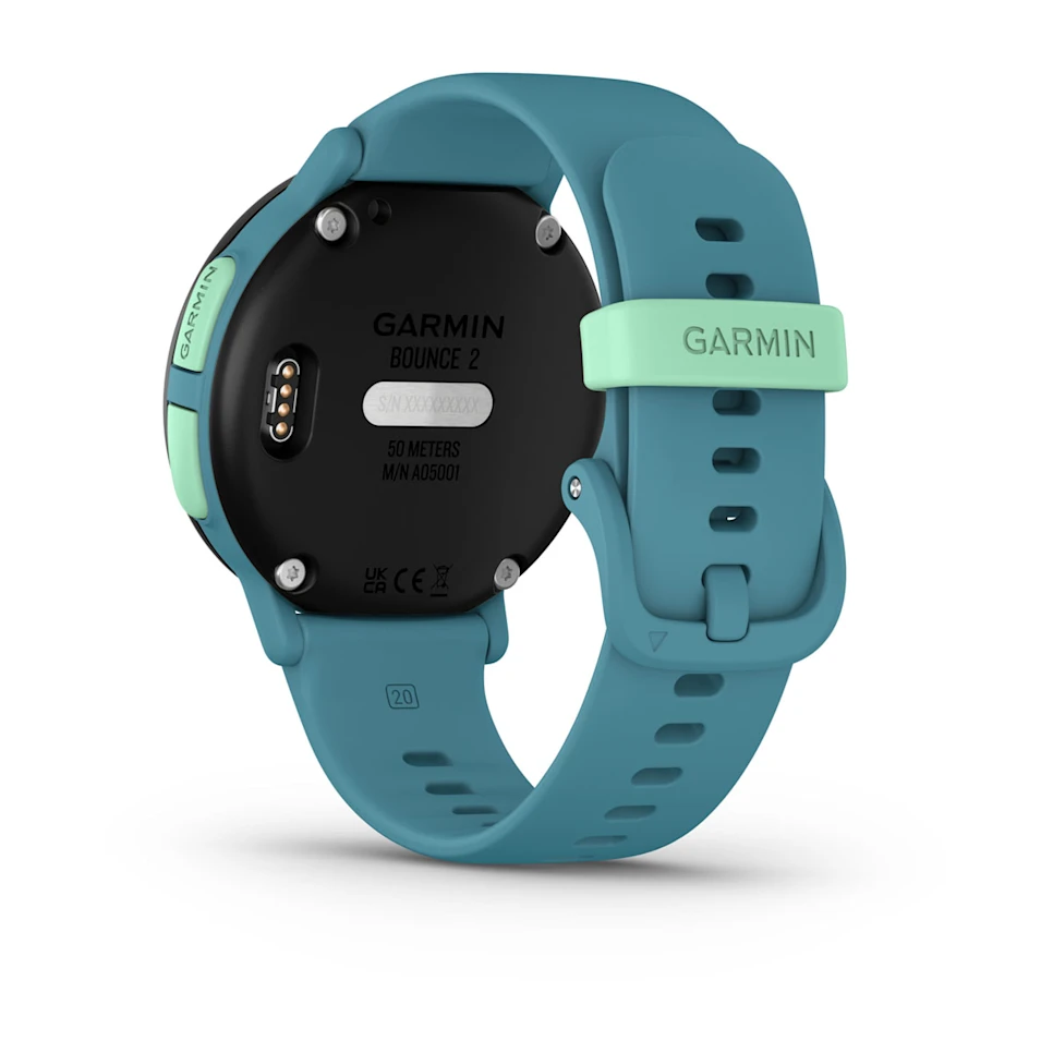 Eine türkisfarbene Garmin Bounce 2 Smartwatch wird gezeigt, mit einem hellgrünen Bandhalter. Das Zifferblatt ist schwarz mit weißem Text.
