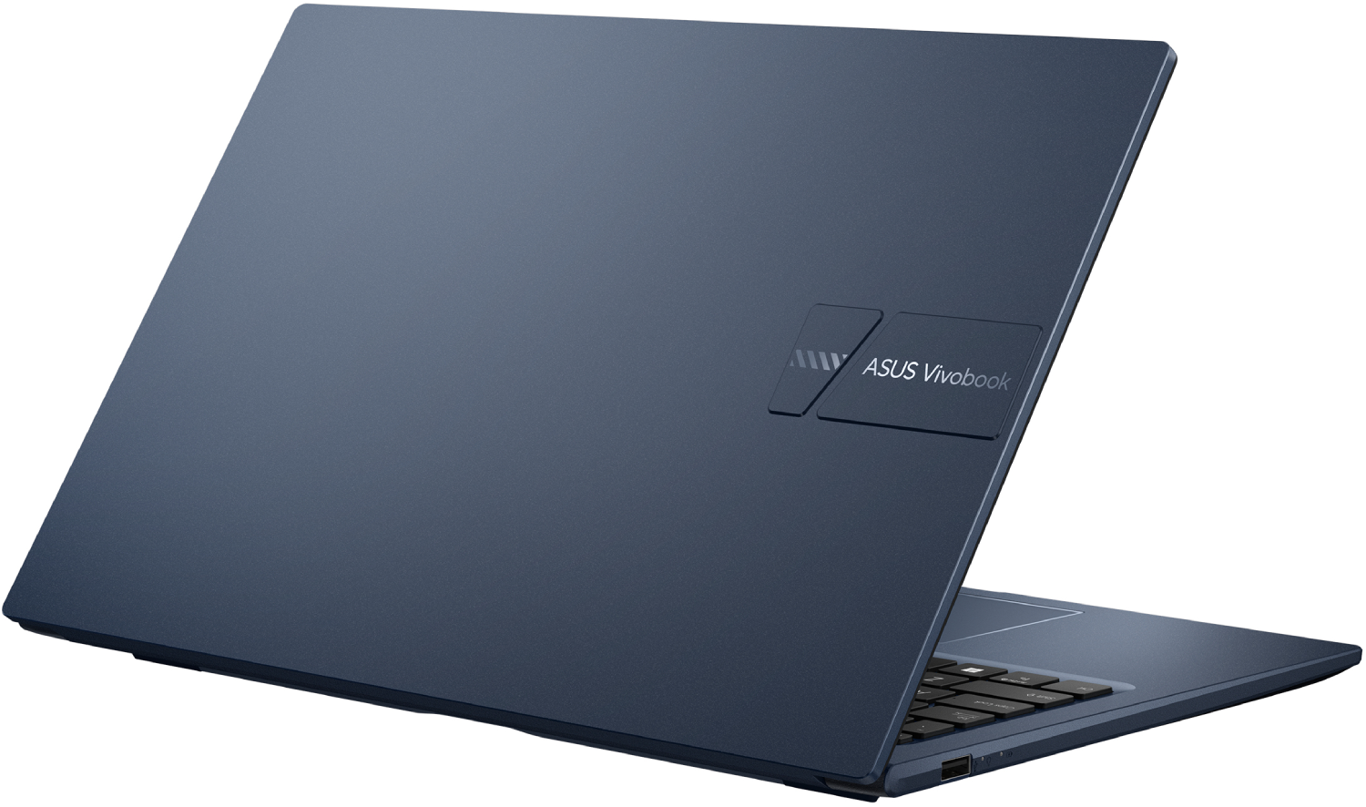 Un portátil ASUS Vivobook azul oscuro está ligeramente abierto. El teclado es visible. La tapa tiene el logotipo de ASUS Vivobook.